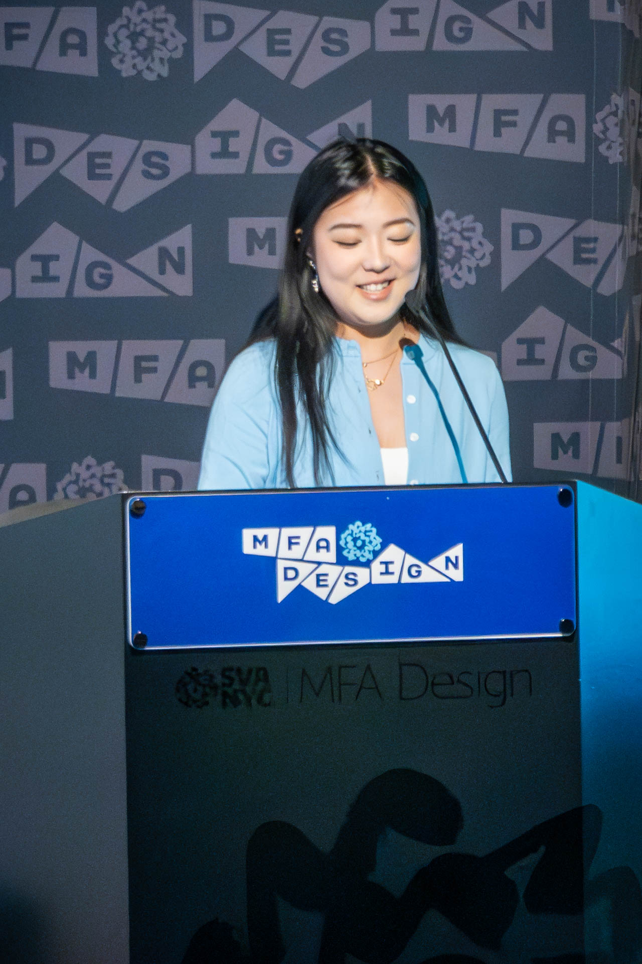 student at a podium giving a presentation