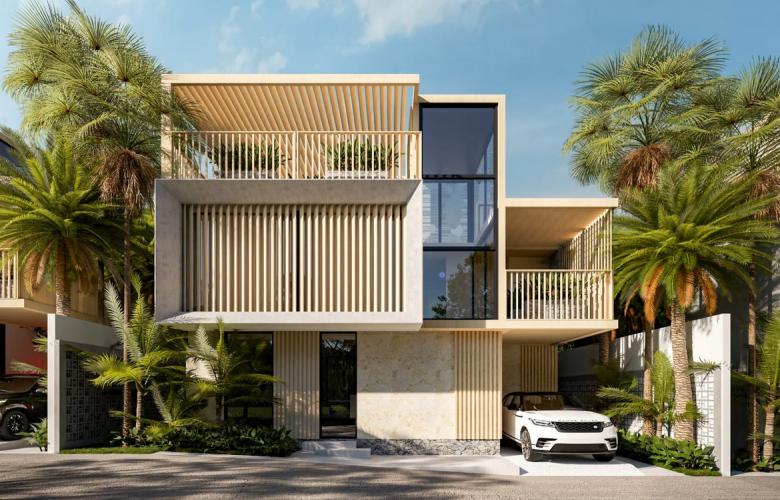 Aerial view of a luxury white villa in Canggu with a long lap pool, listed by expert real estate agents.