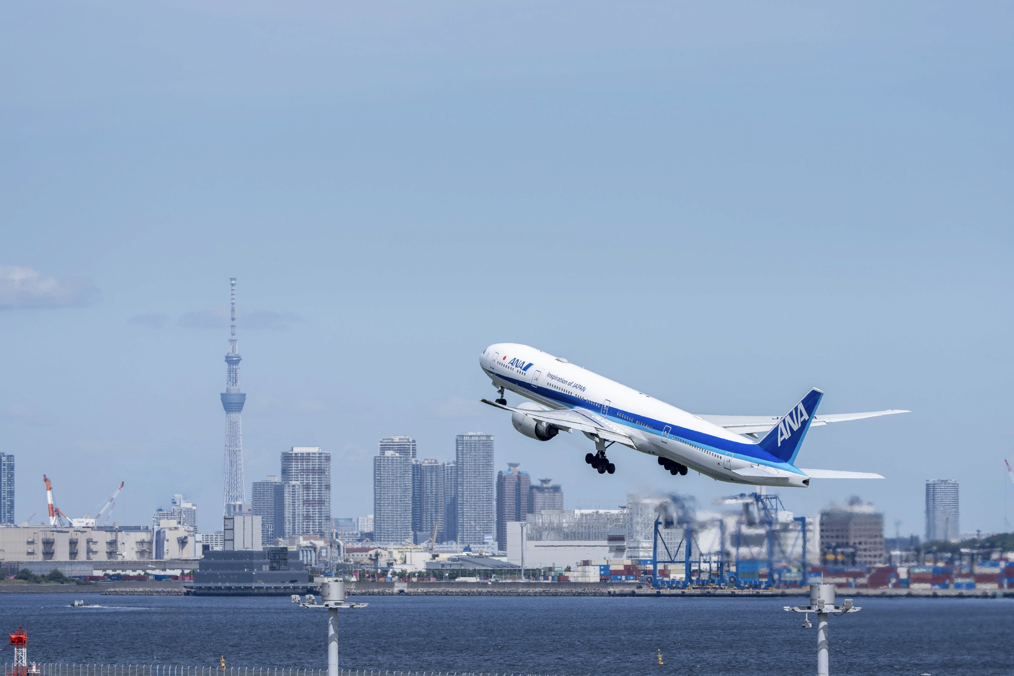 Tropical beach with umbrellas and lounge chairs.