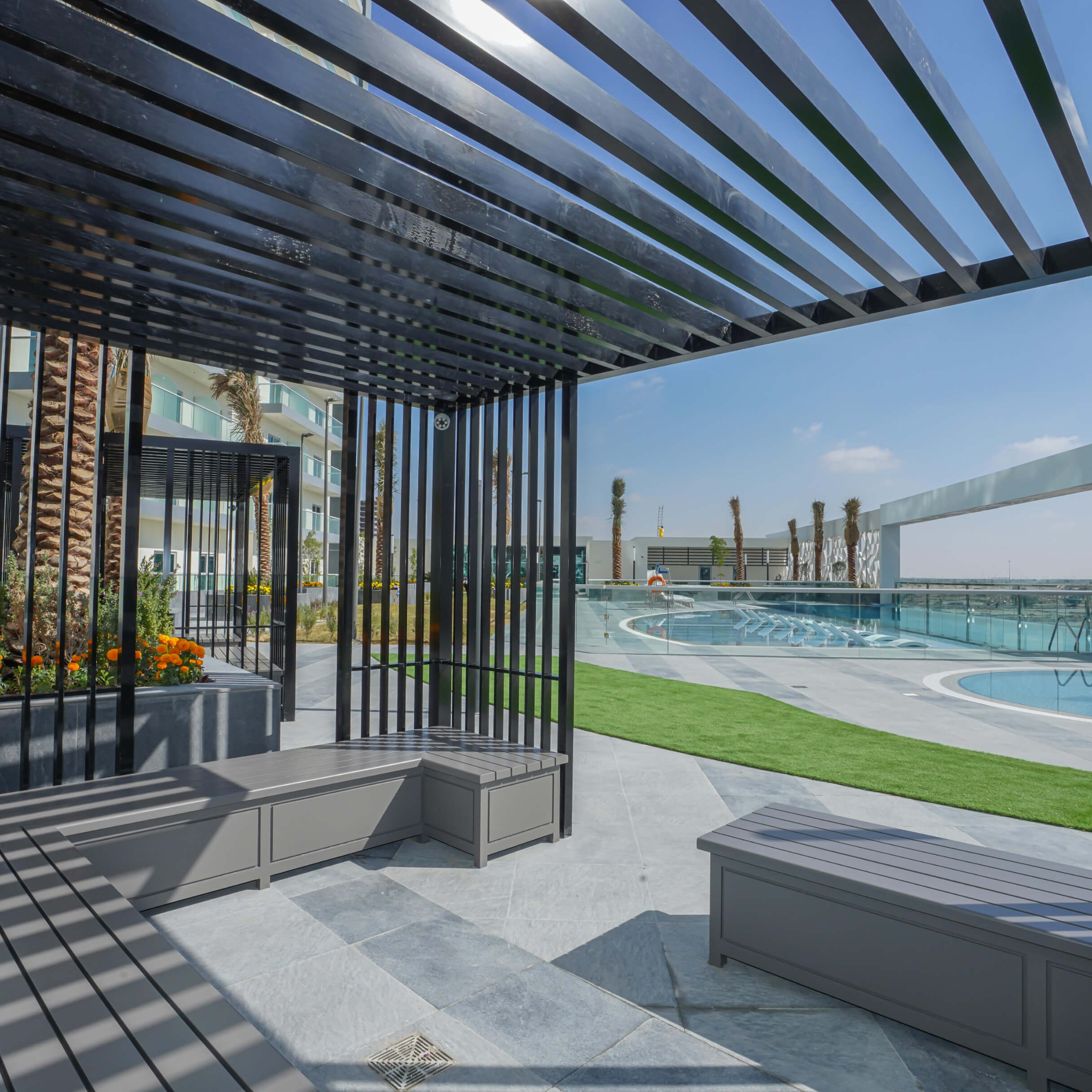 Premium outdoor seating and pool area at Bella Rose. Expert property consultancy for modern living spaces.