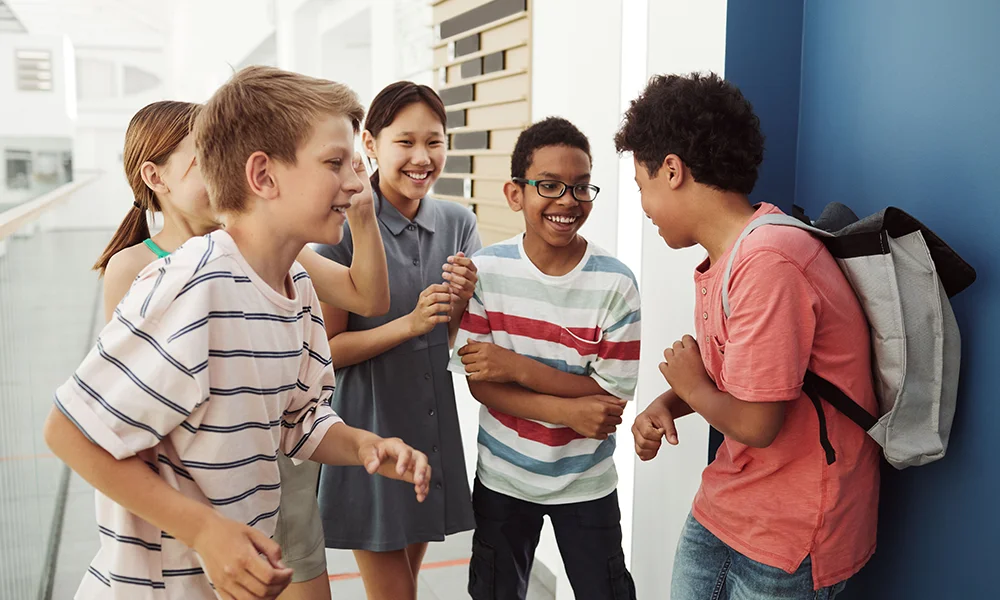 Group of school children laughing together