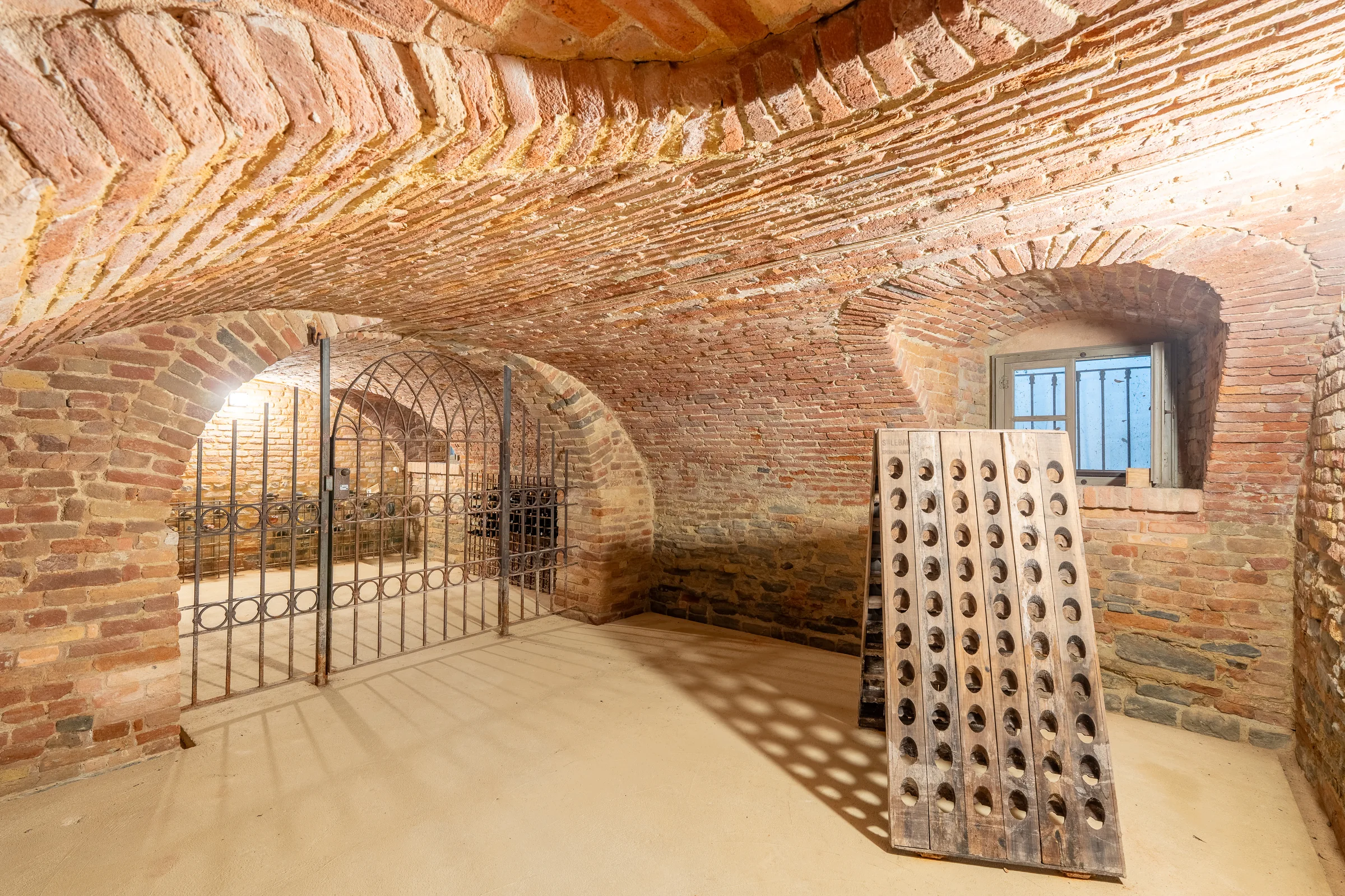 Brick vaulted wine cellar — Nizza Monferrato, Italy. Photography by Yunes Calore.