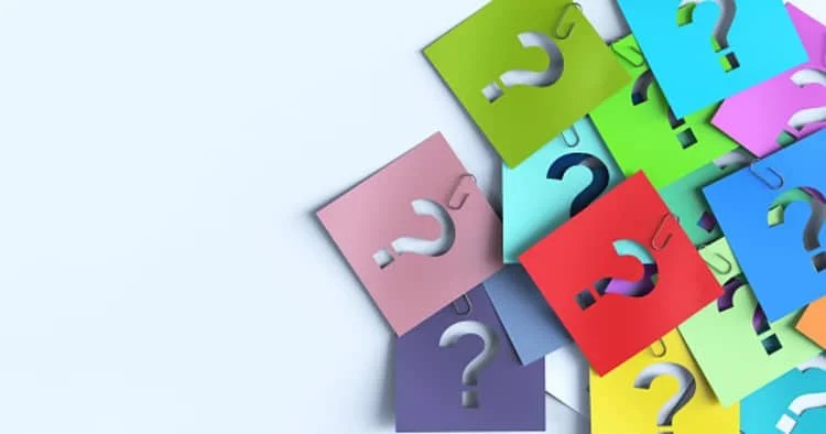 Cards cut out with question mark sign to signify questions asked during SWOT analysis