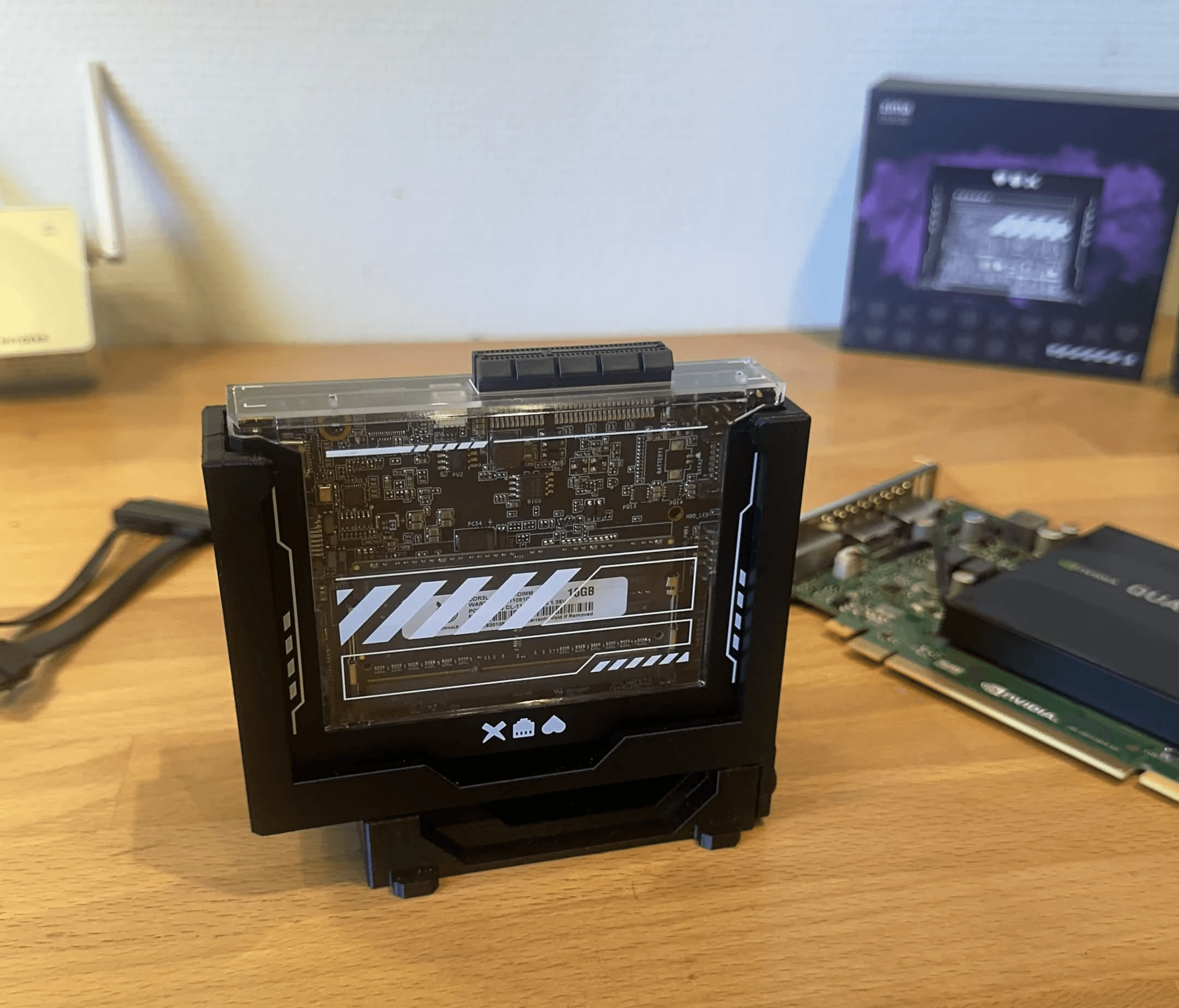 ZimaBlade 7700 installed in a black 3D-printed microRACK  and a Quadro K2200 in the background.