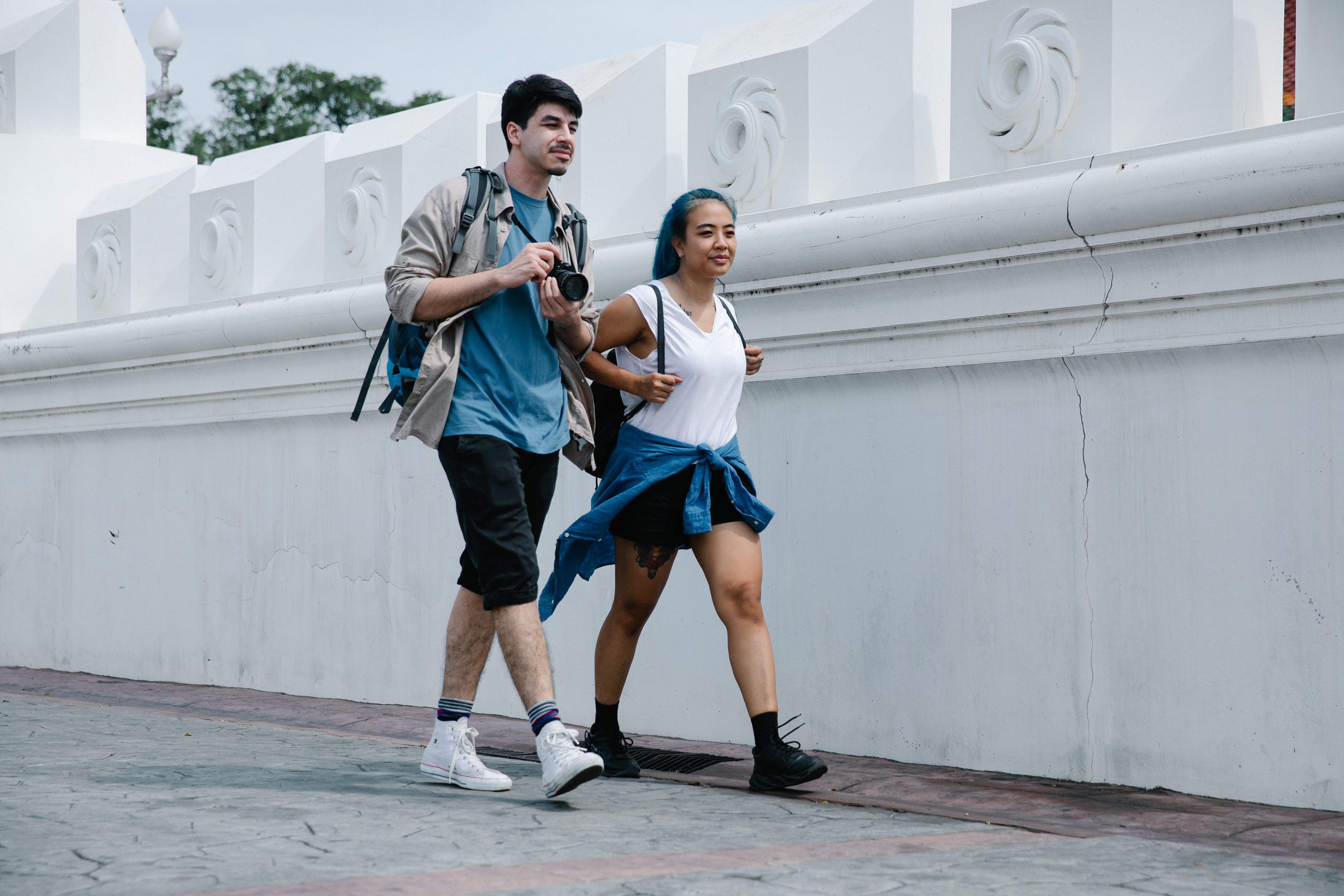 a-couple-enjoys-a-city-walk-together,-capturing-moments-with-a-camera. - george-pak (pexels)