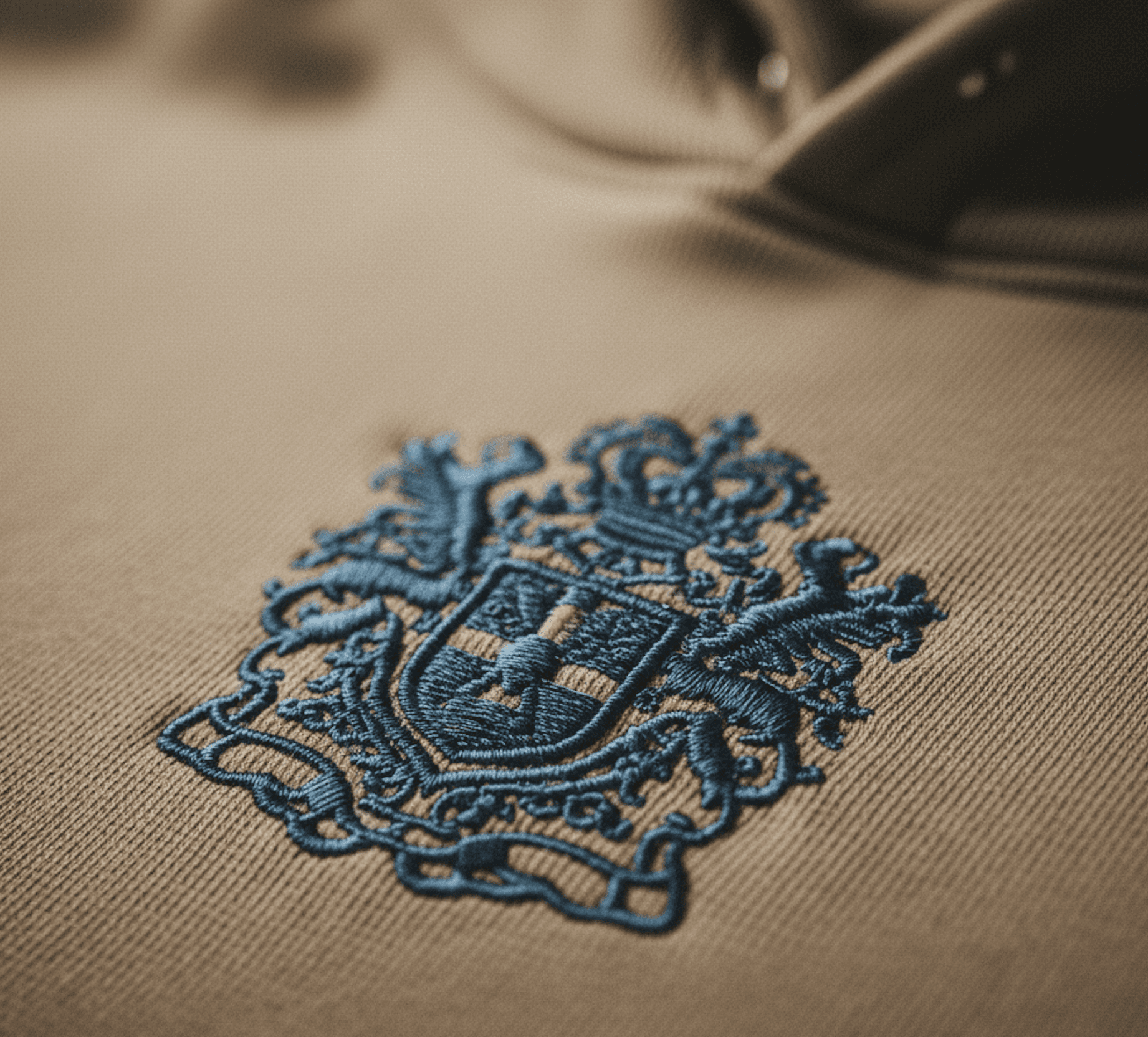 Close up image of a detailed embroidered badge