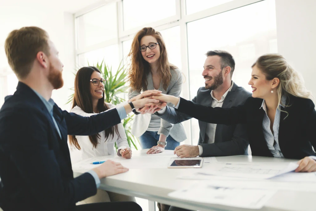 Large all-staff meeting with presenter and engaged audience