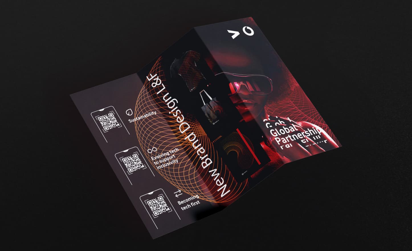 Printed brand launch collateral titled 'New Brand Design', showcasing the red wireframe visual language and key icons for sustainability and tech inclusivity.