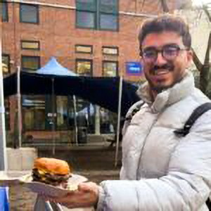 Shirtless man sipping espresso
