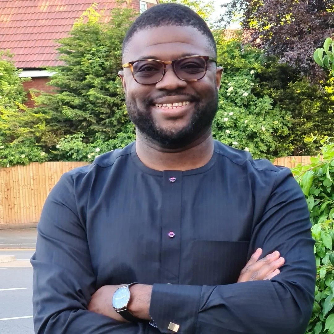 woman in black long sleeve shirt sitting on white couch
