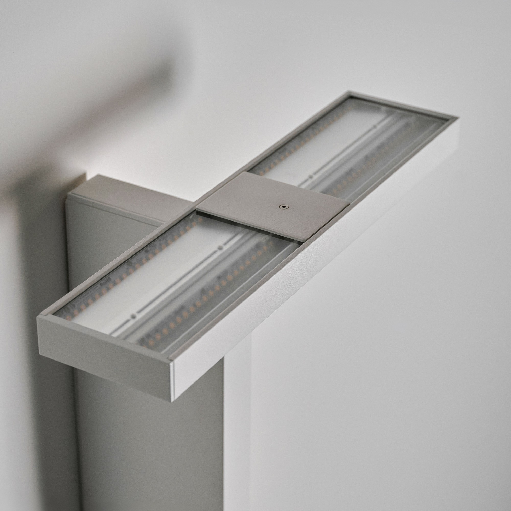 Fixture details of the Offset, a LED wall light in white finish, designed for architectural interiors in Canada.