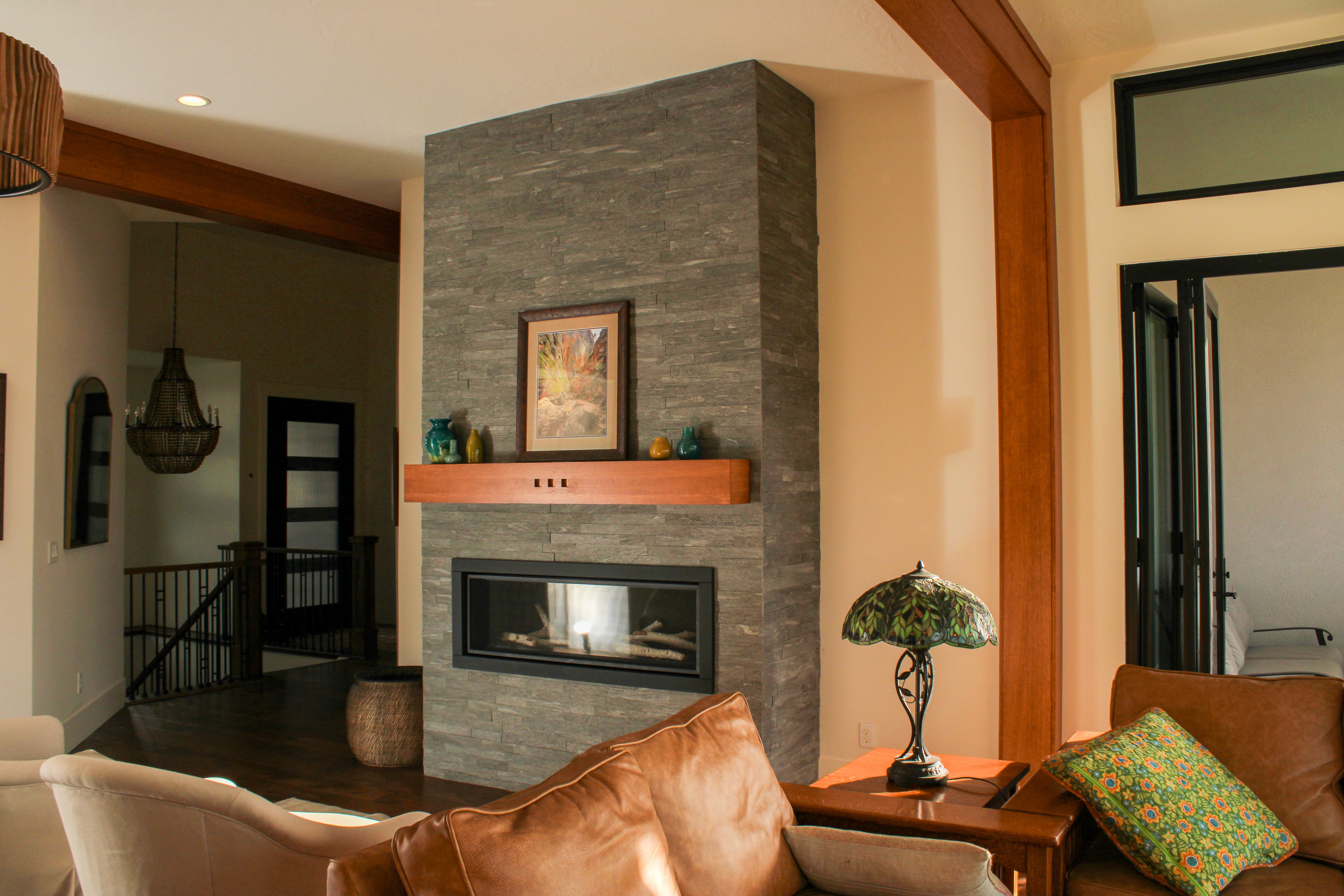 Fireplace in a St. George Utah remodel with detailed wood accents and cozy 70s-inspired design