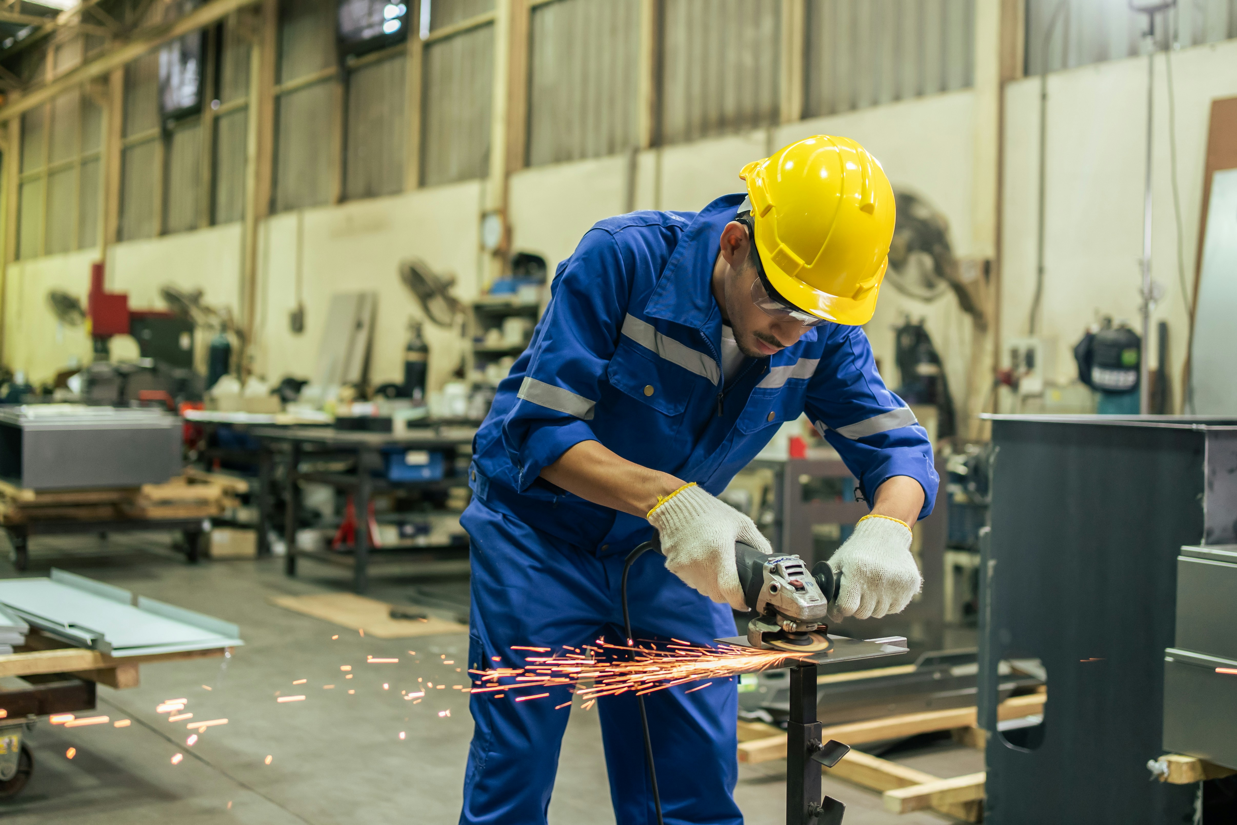 A cozy indoor scene with warm lighting, someone focused on a task at a wooden table, surrounded by natural elements.