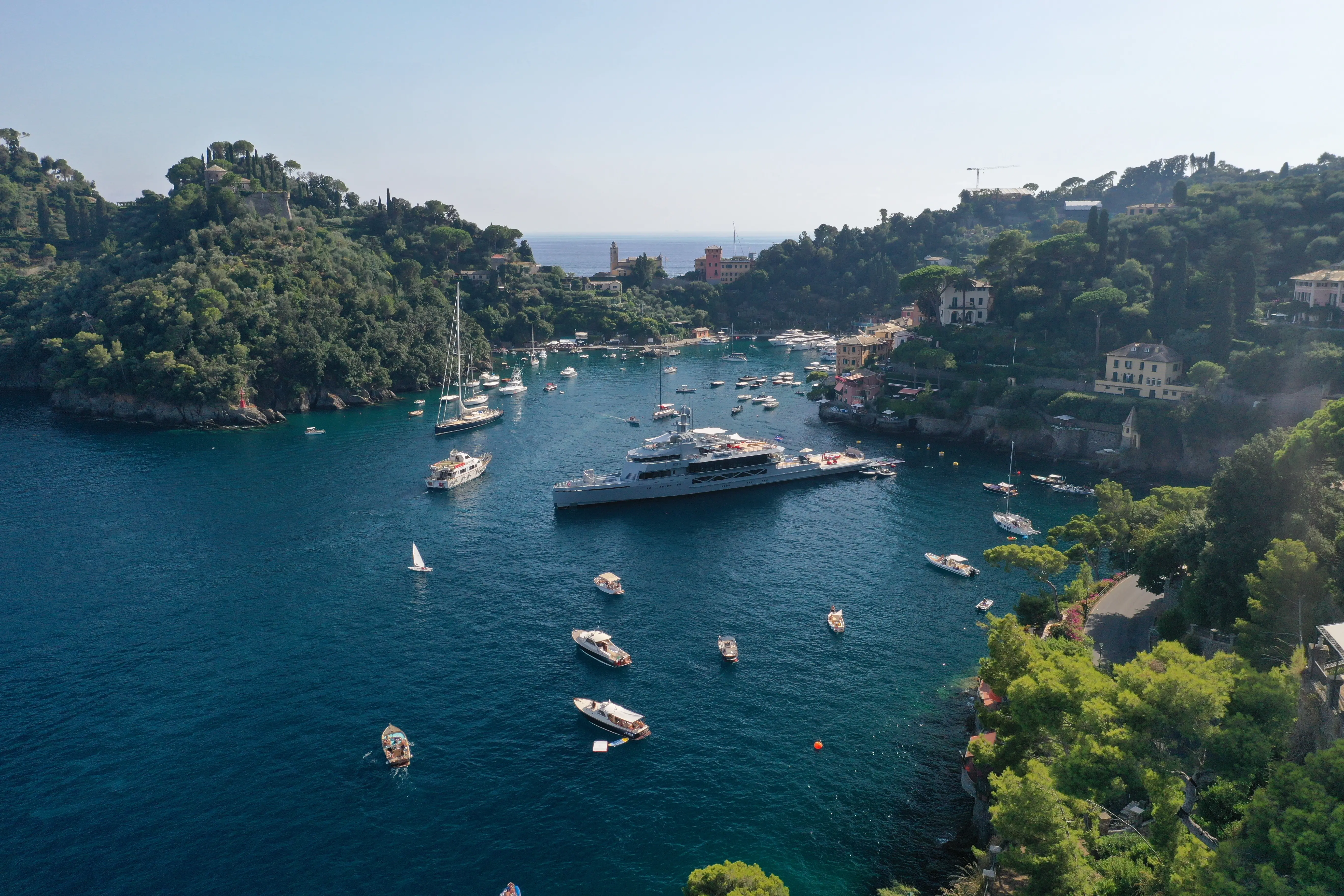 Cozy cave spa with loungers beside turquoise pool.