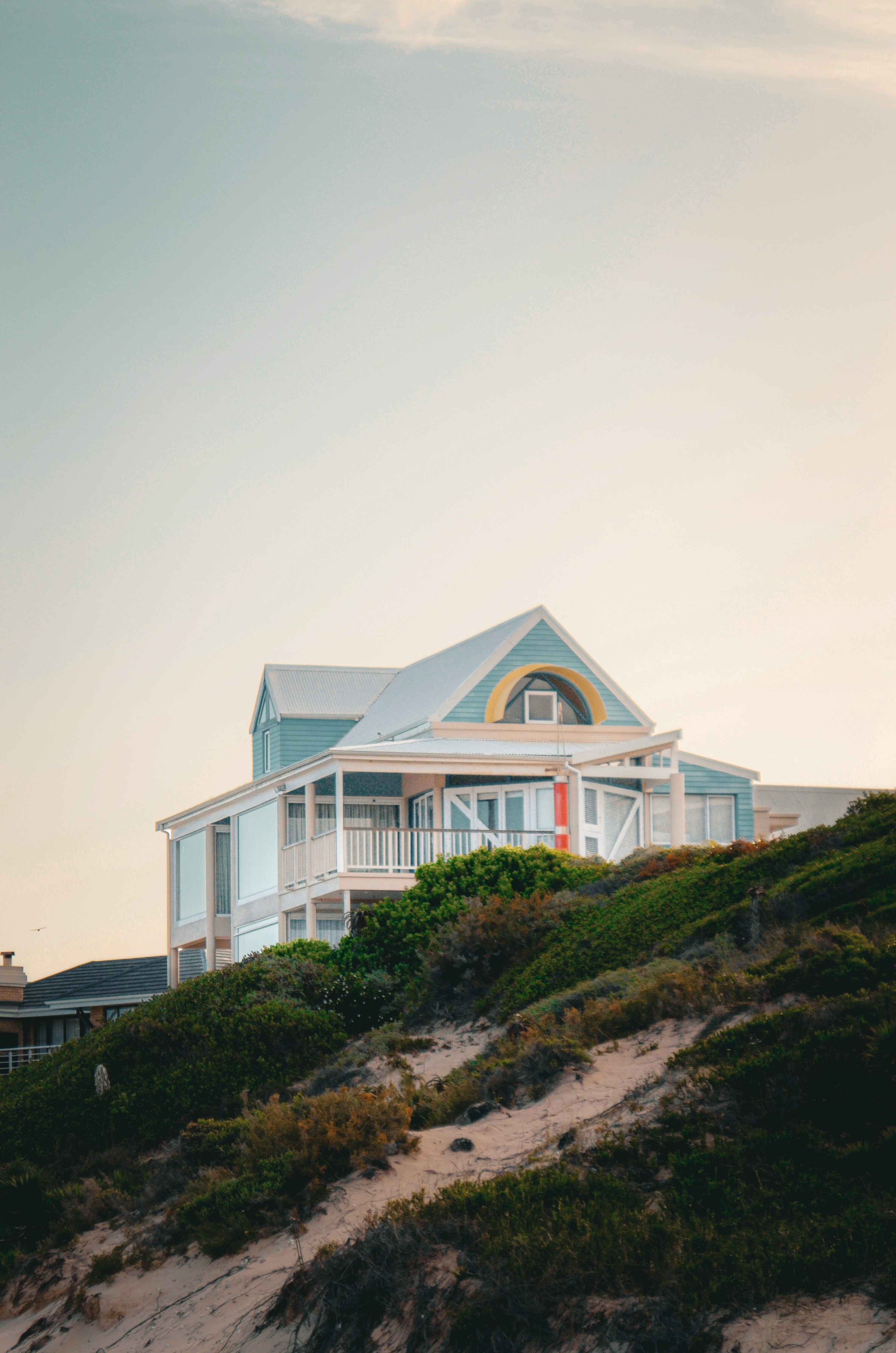 A house on a hill overlooking the ocean