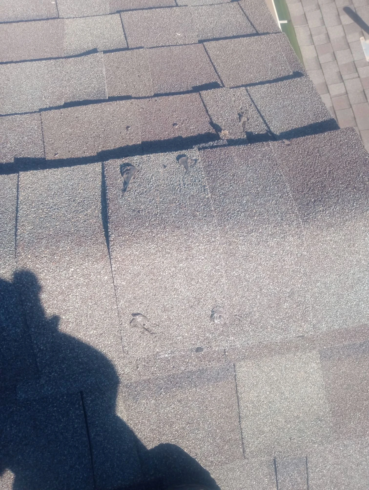 Before repair: metal cap flashing at vulnerable roof edges in San Antonio, Texas.