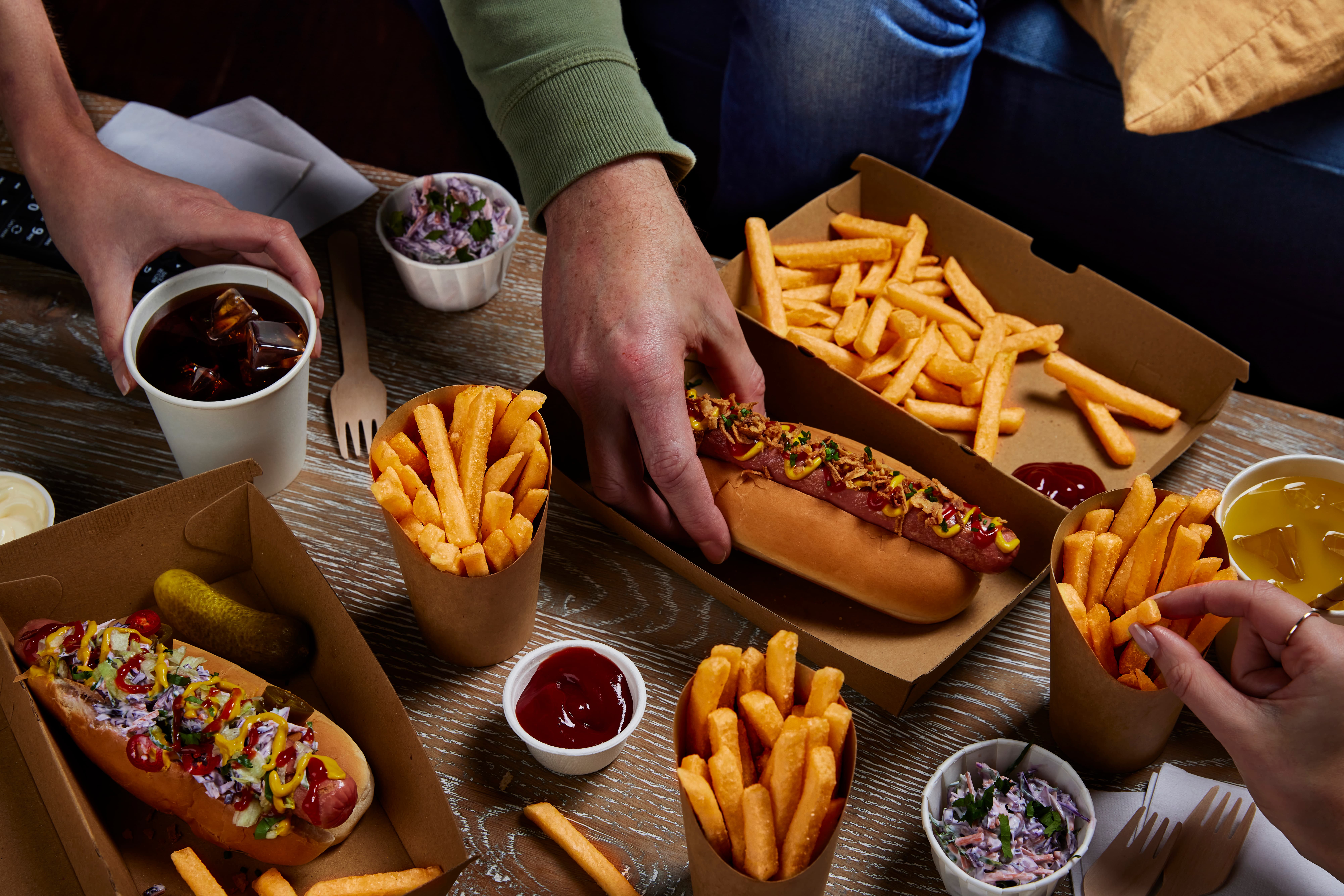 Crispy McCain SureCrisp fries served with loaded hot dogs, sauces and slaw,