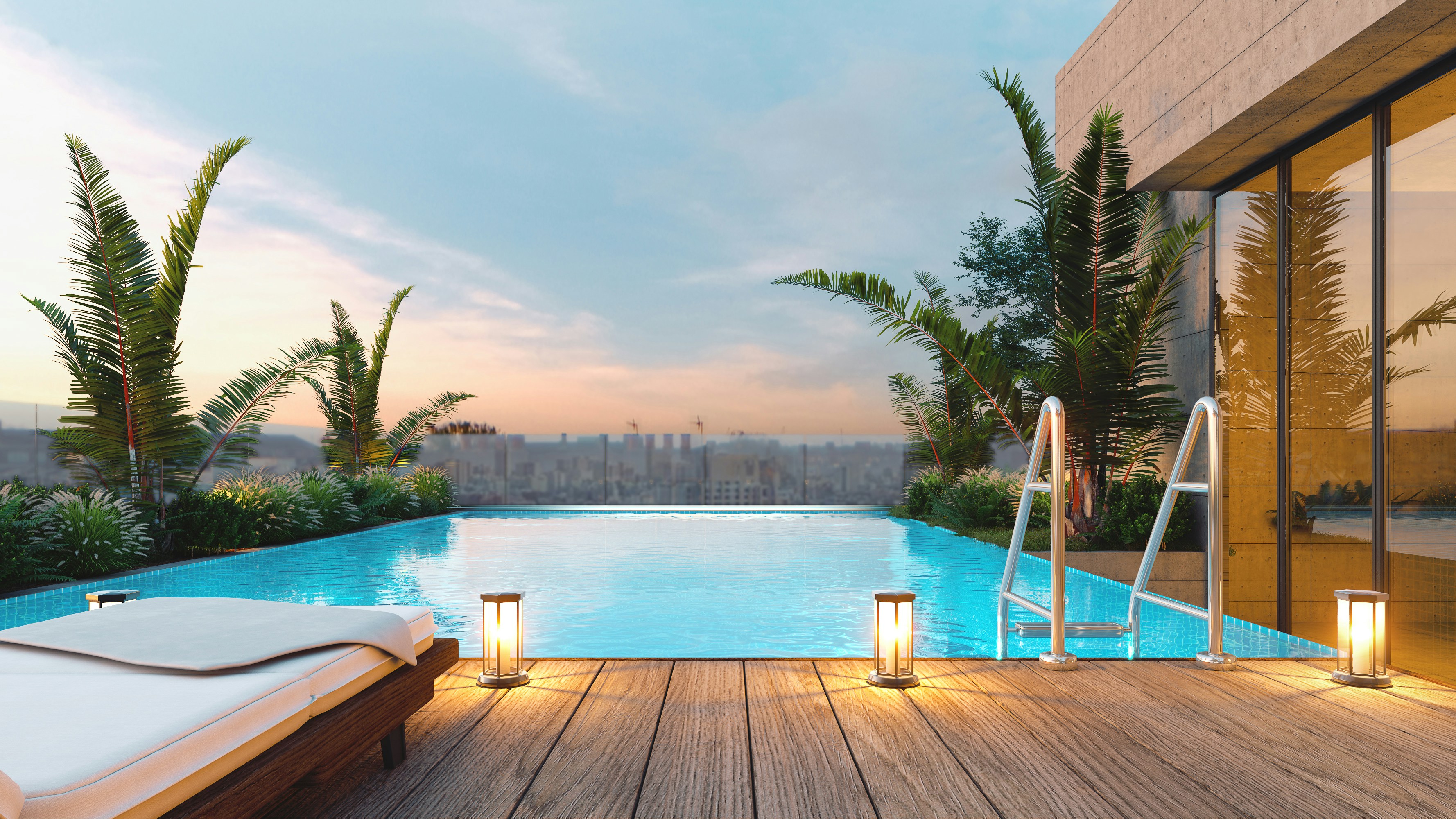 Rooftop swimming pool with lounge chair at sunset.