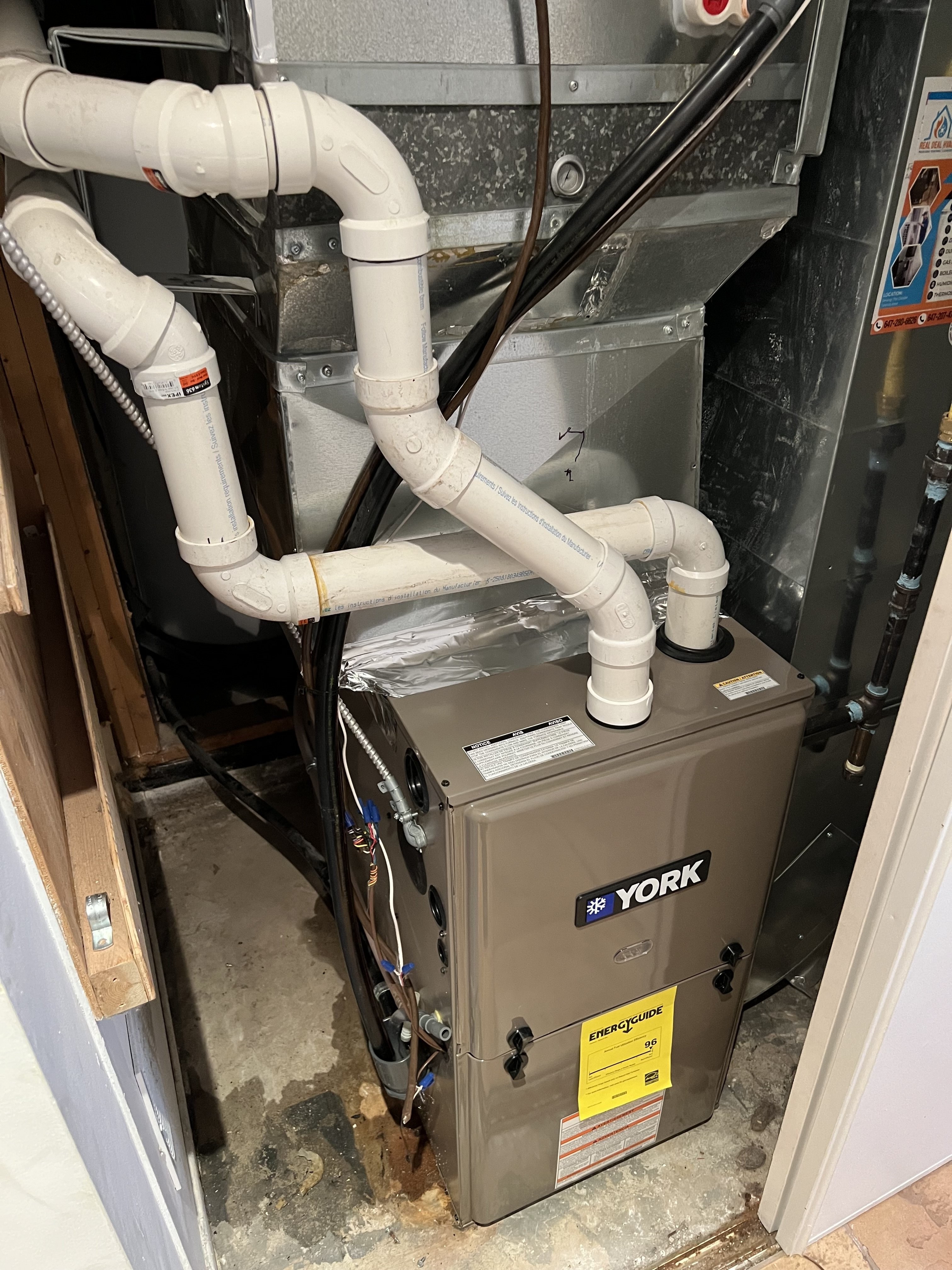 furnace being installed in a basement of a home in mississauga