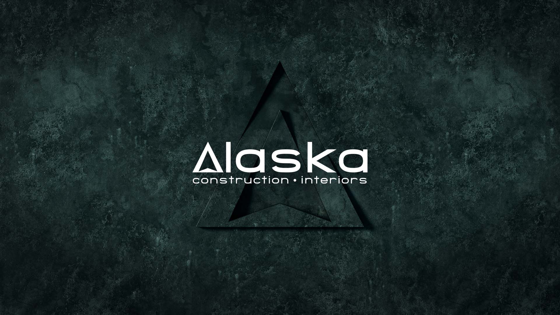 Alaska logo on deep green stone texture