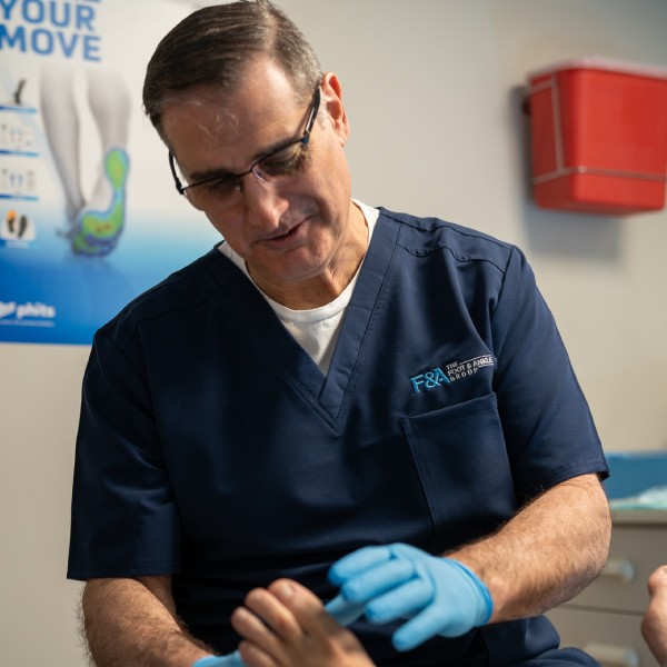 A man holding his leg