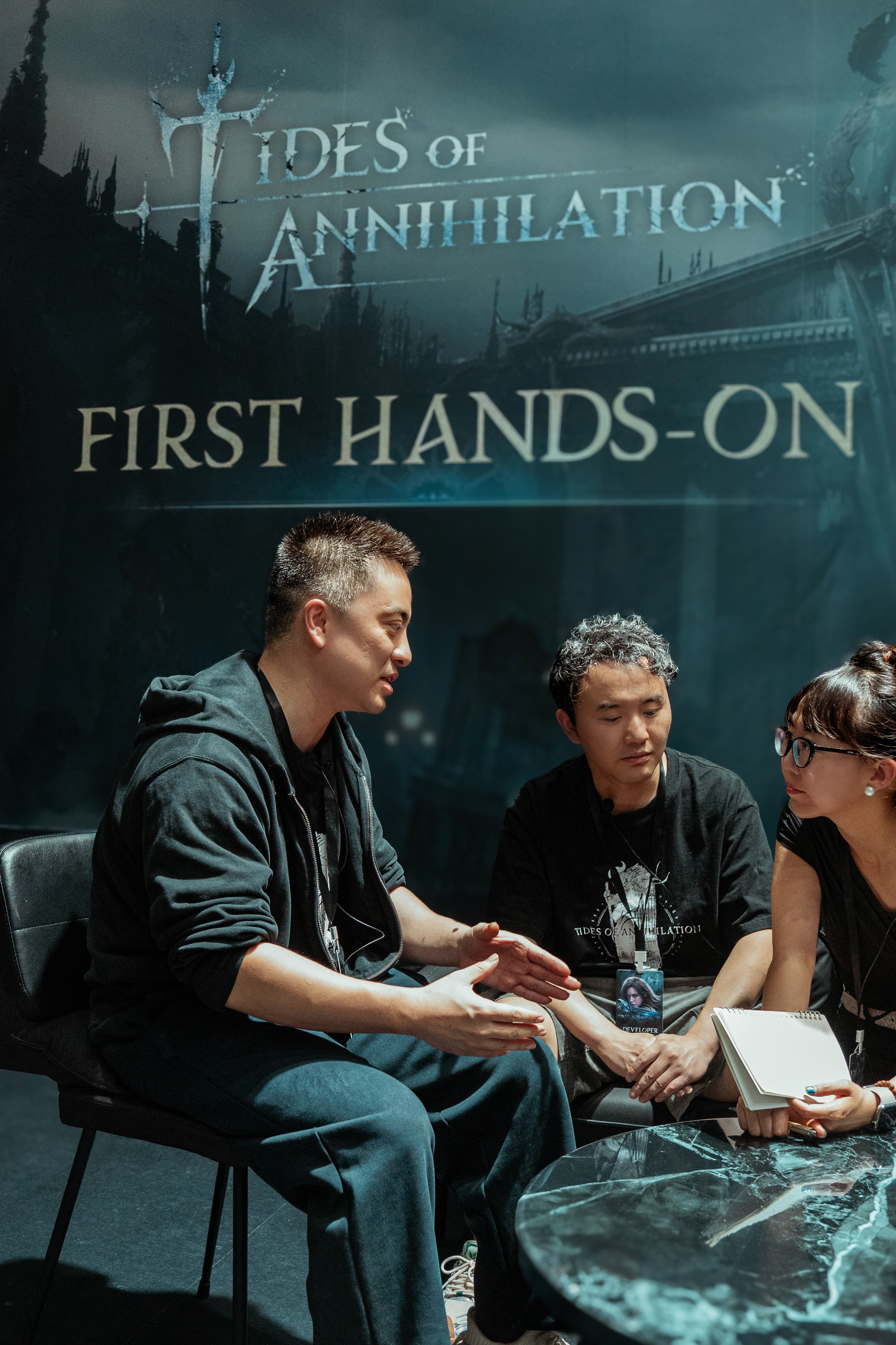 Tides of Annihilation developers Pengfei Lian, Kun Fu, and translator 