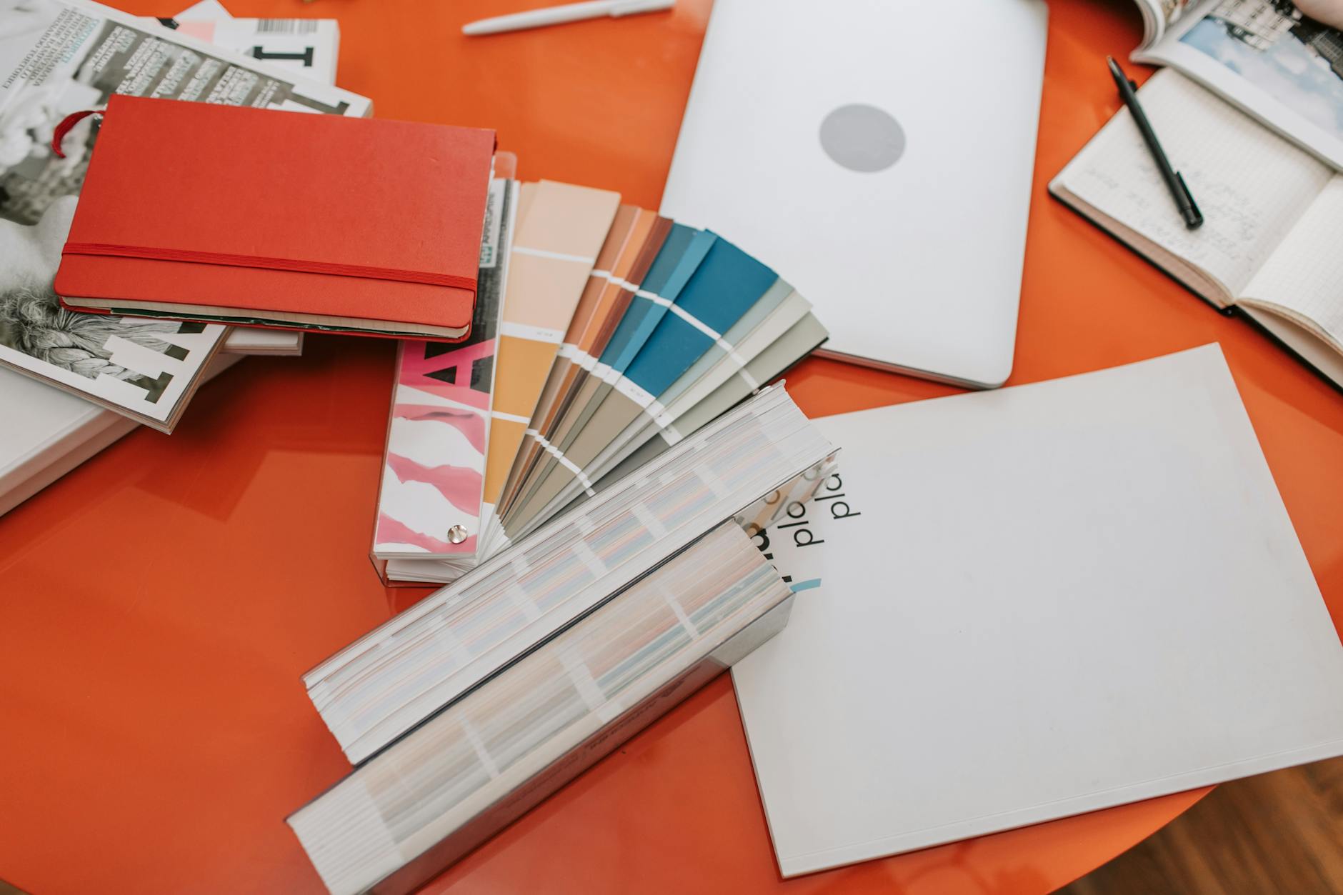 Top-down view of a student's desk featuring a tablet, a printed worksheet, and colorful tactile learning blocks.