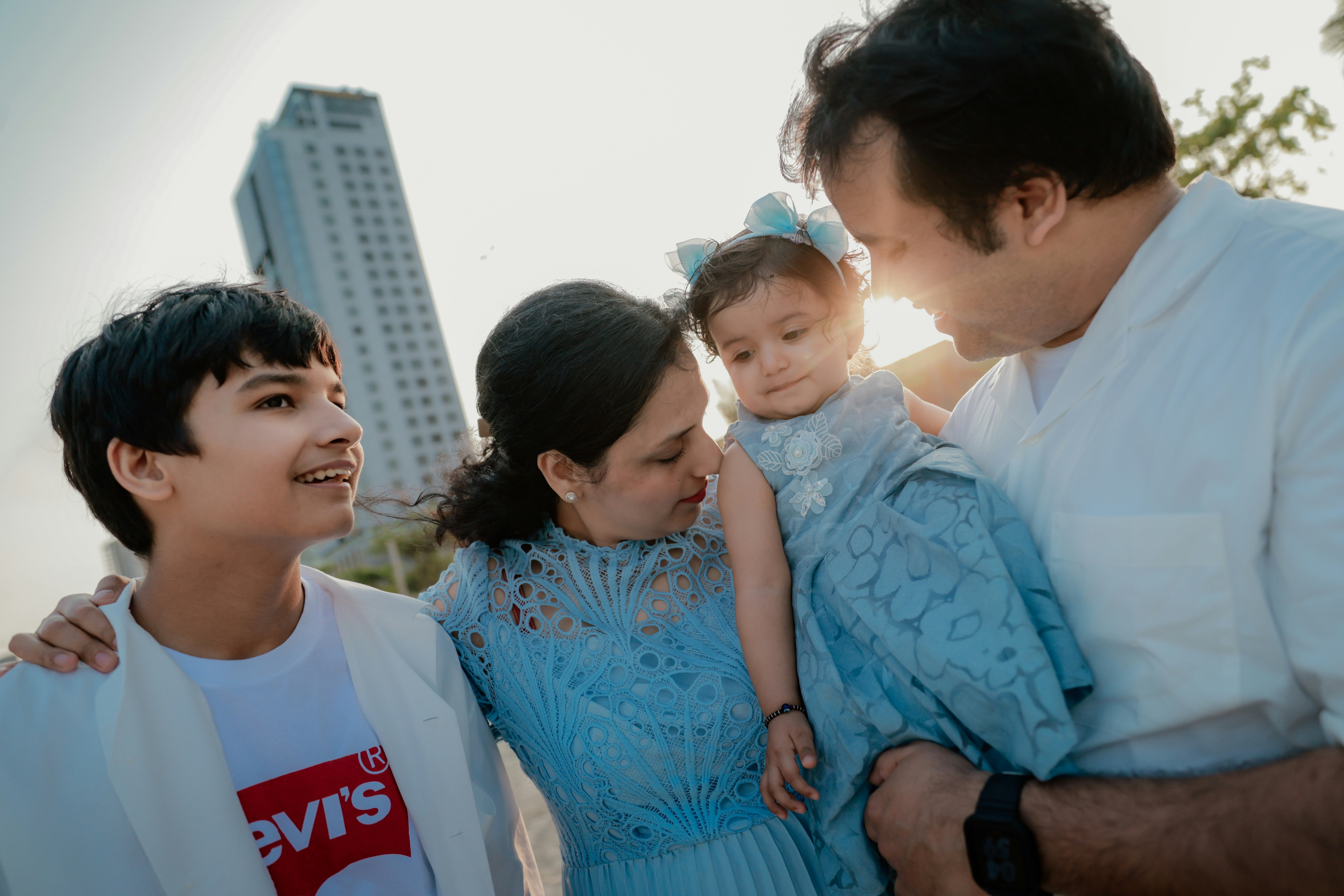A family with two children enjoying a sunny day.