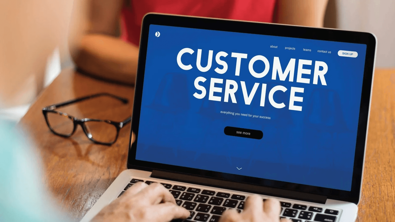 Person using laptop for customer service - Churnzero Competitors