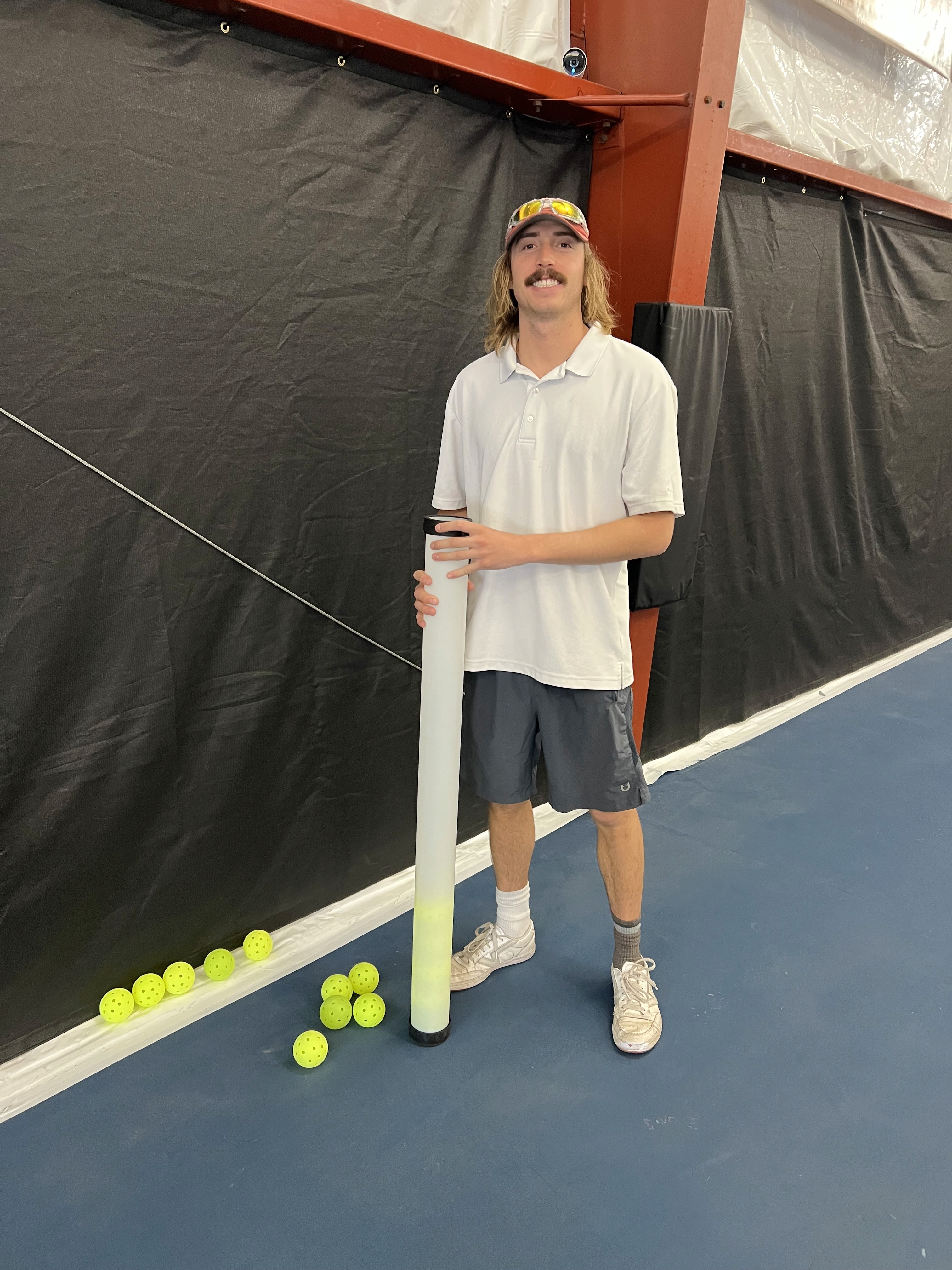 Instructor Devin McCausland on an indoor court