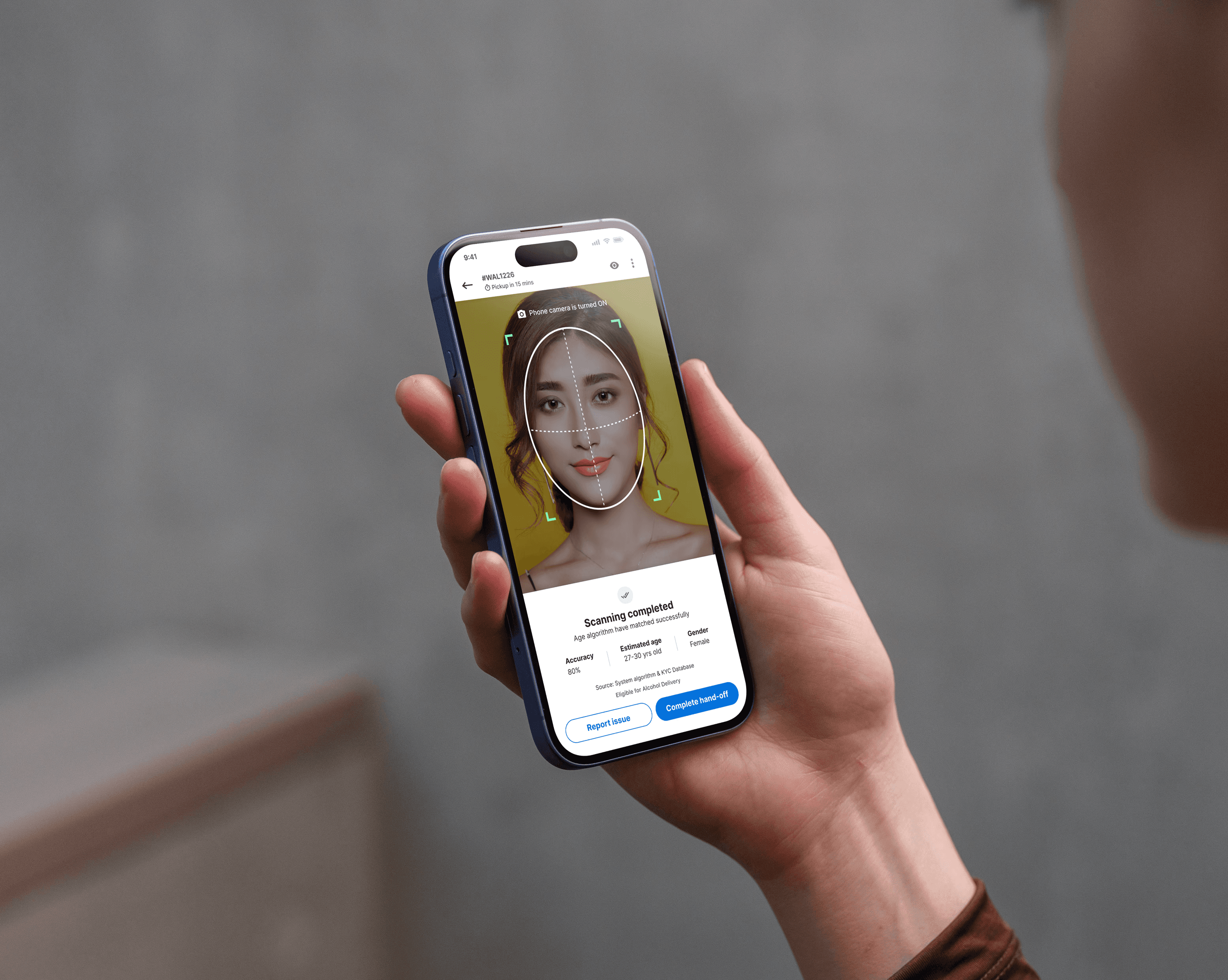 Woman pressing power button on an iMac desktop computer.