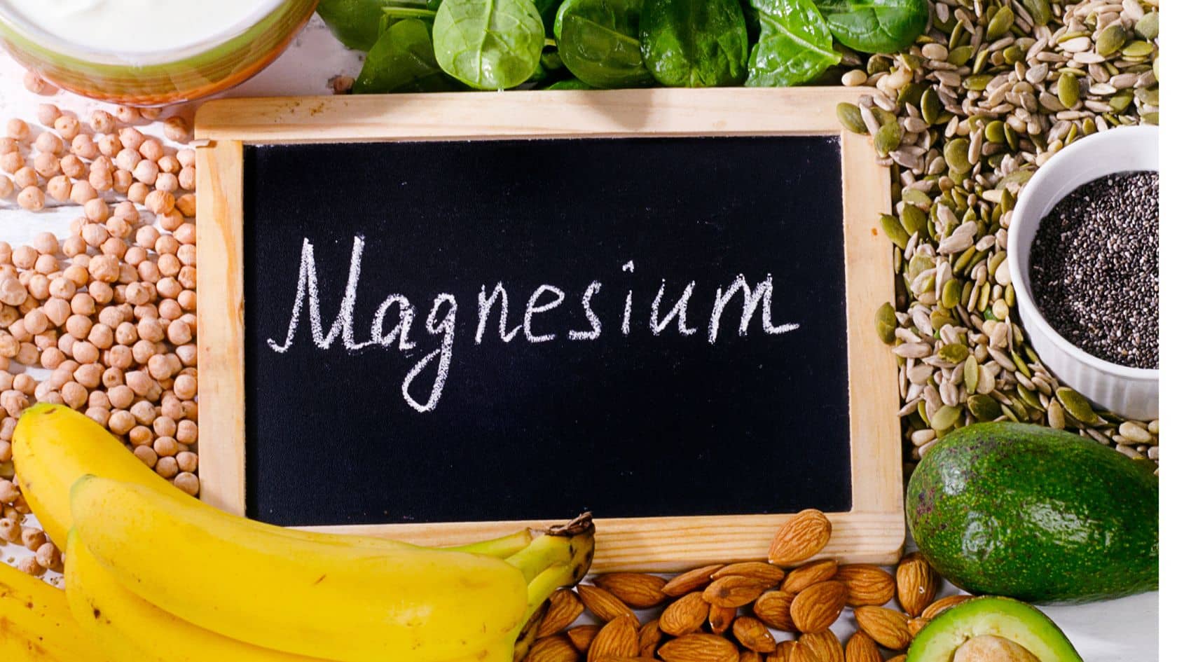 a sign that says "magnesium" surrounded by fruits and veggies that contain magnesium
