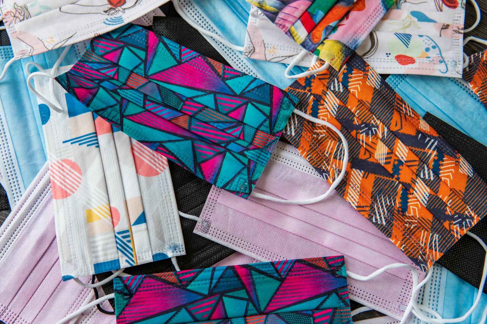 A colorful assortment of patterned cloth face masks showcasing variety and style.