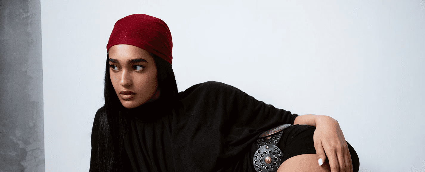 Laptop displaying website on wooden table