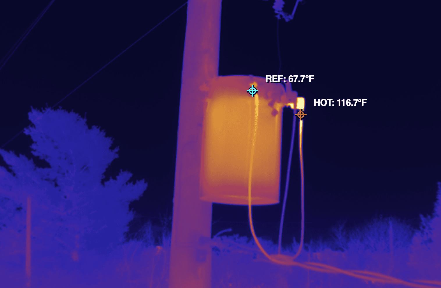 a thermal image taken from a DJI drone of a pole mounted transformer