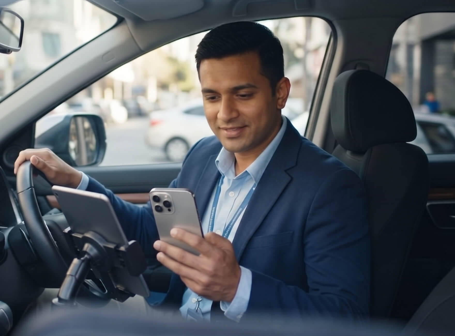 A desk with a laptop and an employee badge laying on top of it.