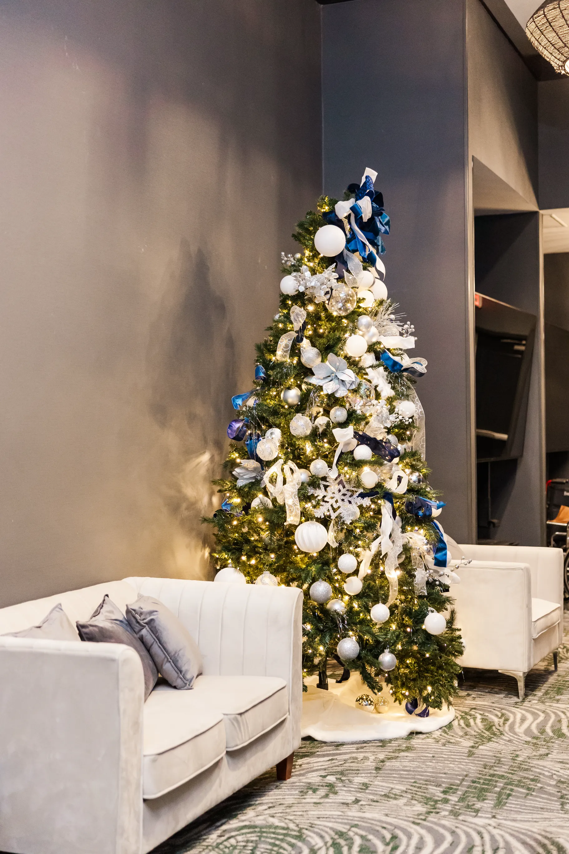 Luxury table setting by Sarah Overall Events with pink embroidered napkins, gold-rimmed plates, floral arrangements, and personalized menus in Shreveport.