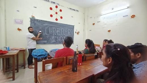 A person standing in front of a blackboard

Description automatically generated