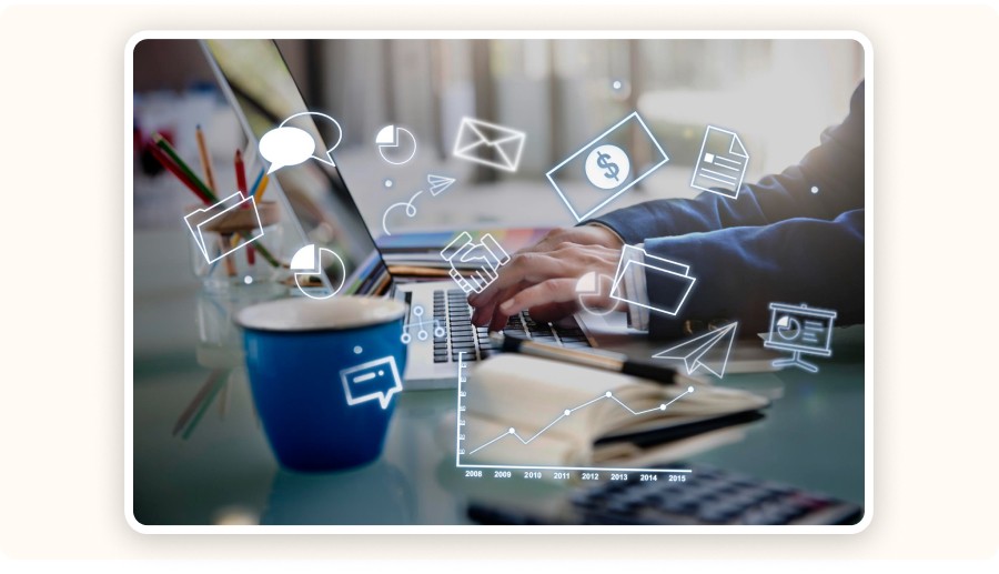 Person typing on laptop with digital marketing icons, analytics, and communication elements