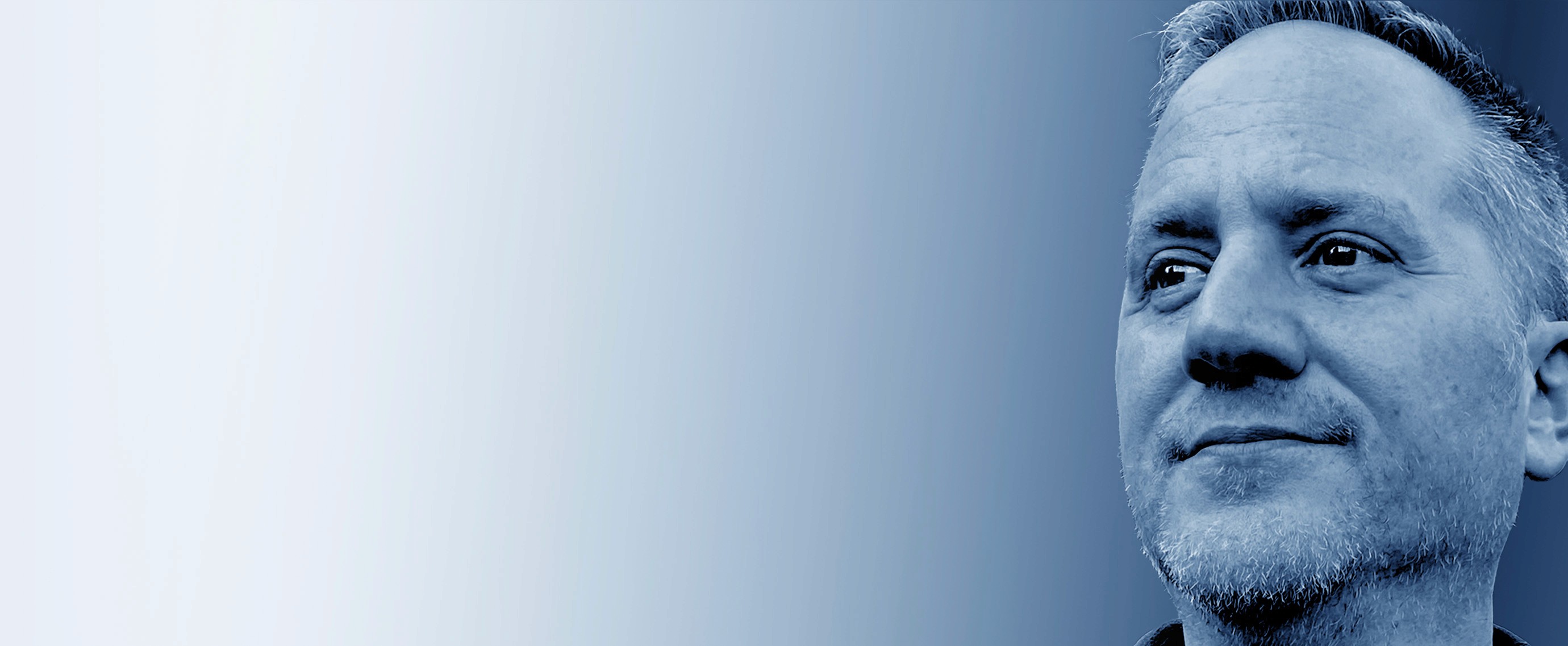 Grayscale close-up portrait of Jeremy J. McLean, Senior UX, Visual, and Motion Designer, featured in hero banner with gradient blue background.