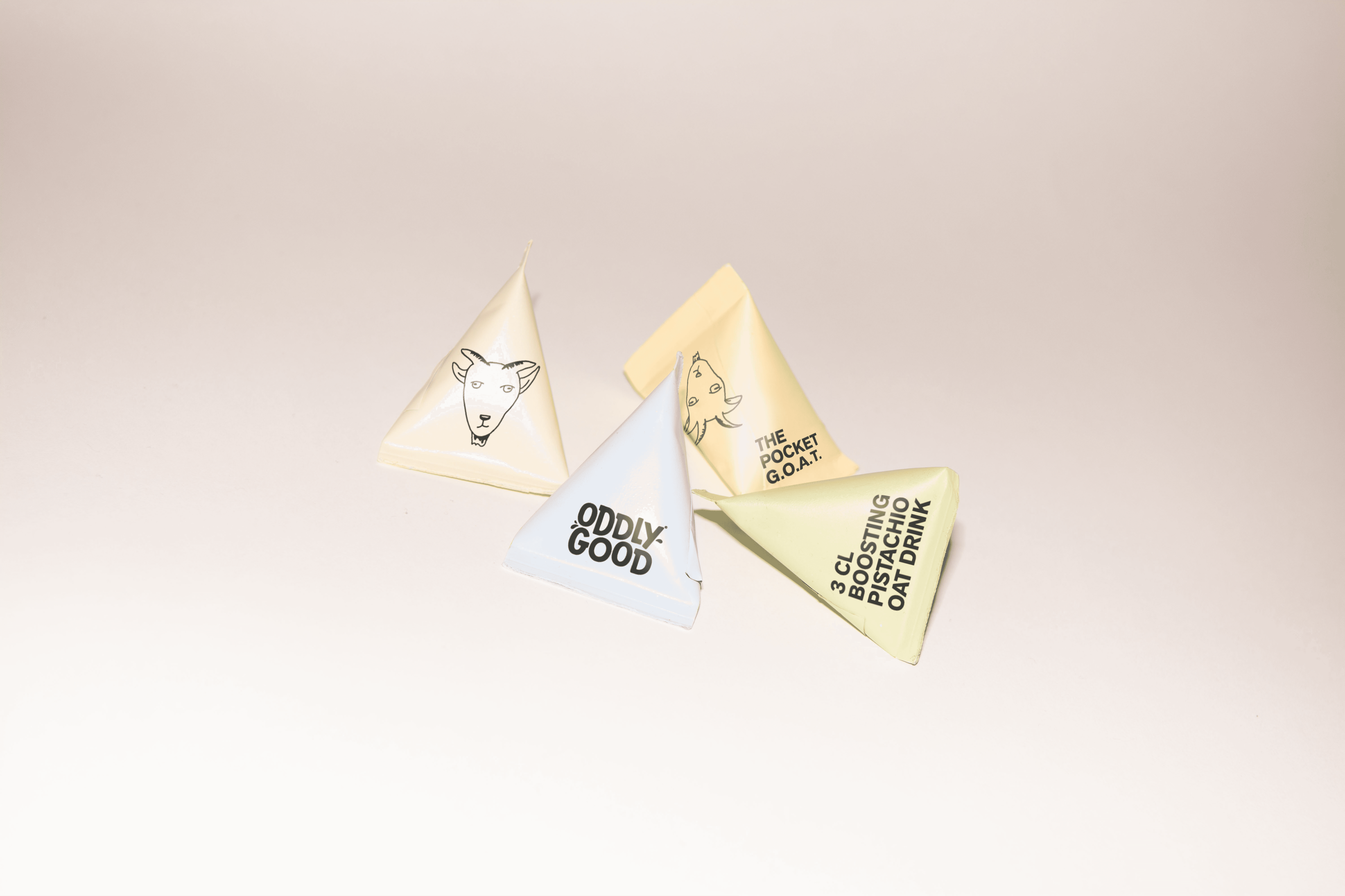 White branded cap with turquoise logo placed on fresh lemons in a red bowl