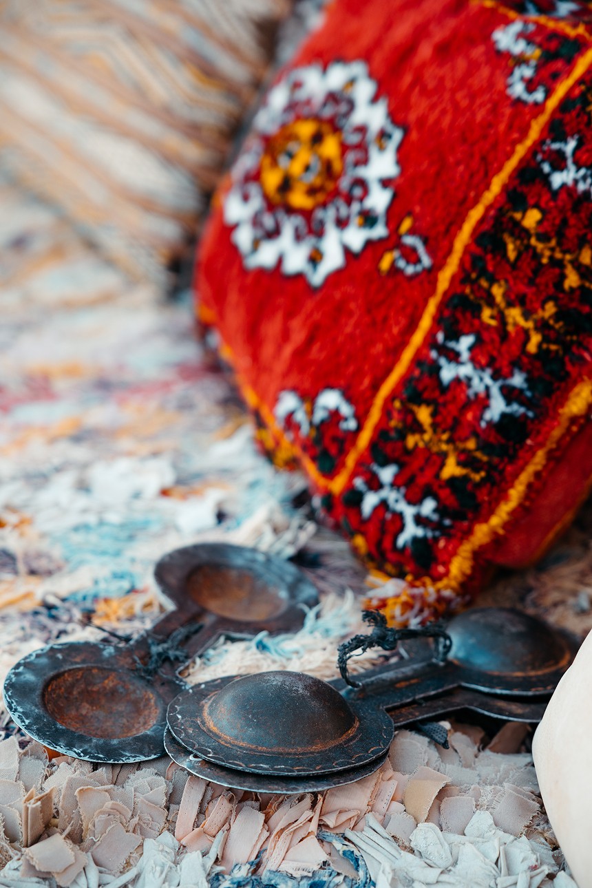 A tall palm tree against a clear blue sky.