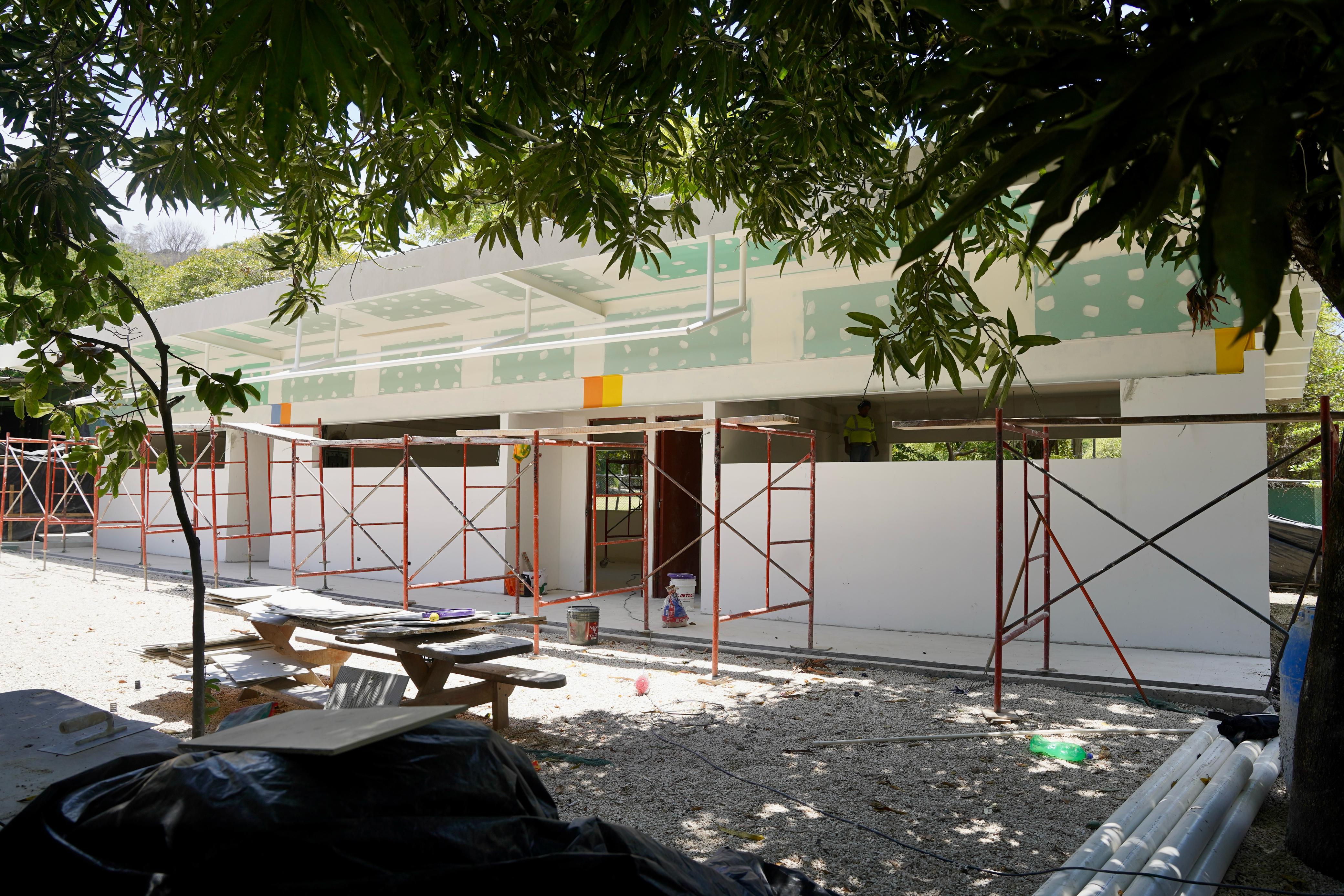 a black and white living room with a large tv