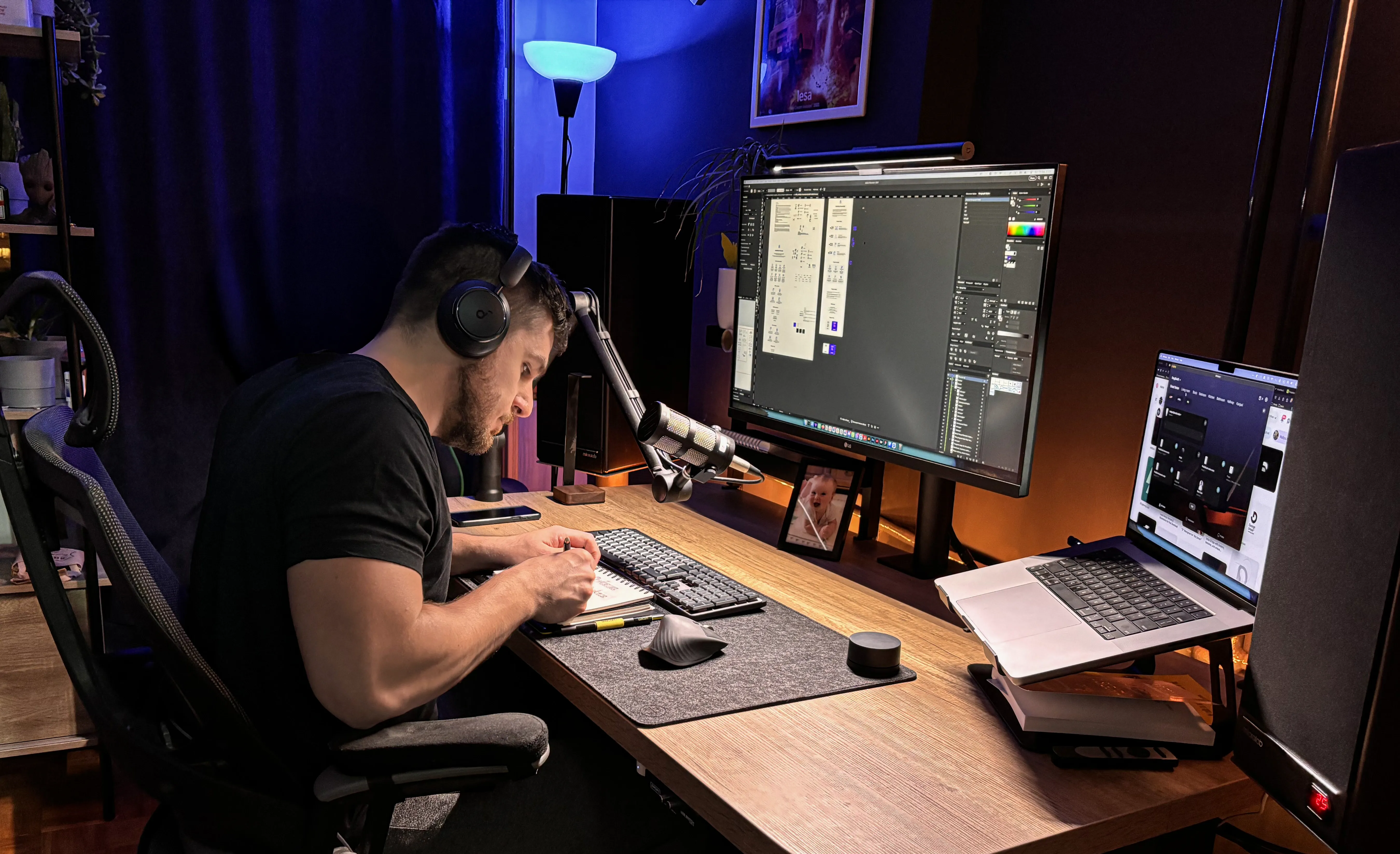 Sasha drawing on sketchbook while sitting at his desk