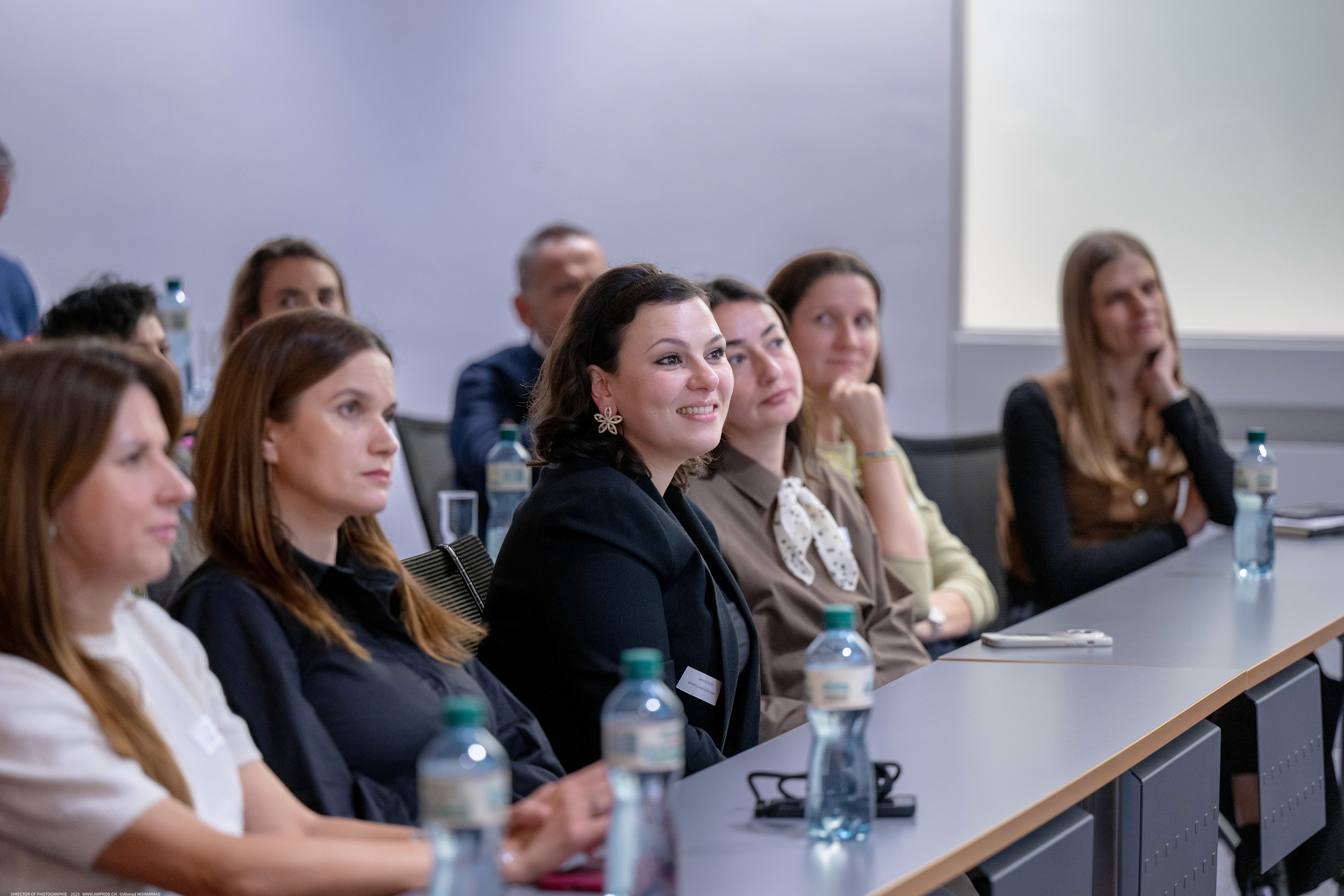 Professionals attending a training session in a modern conference room