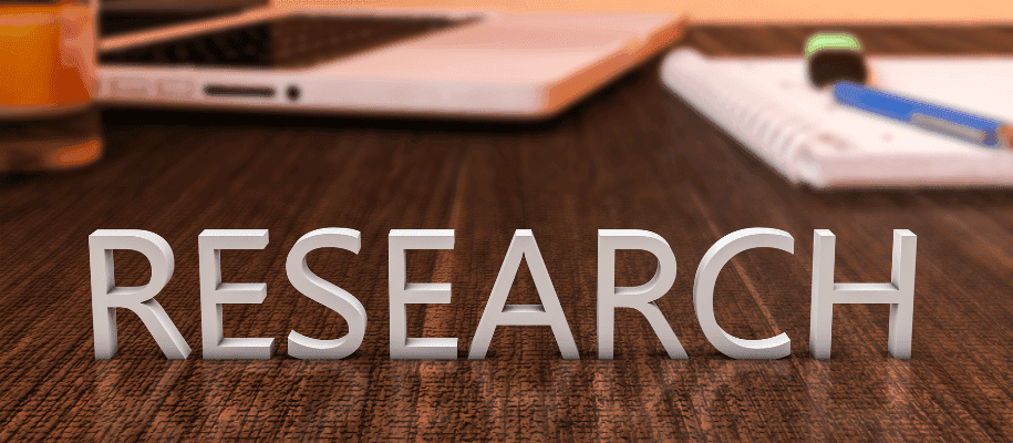 High school student working on original research paper with PhD mentor guidance for college admissions