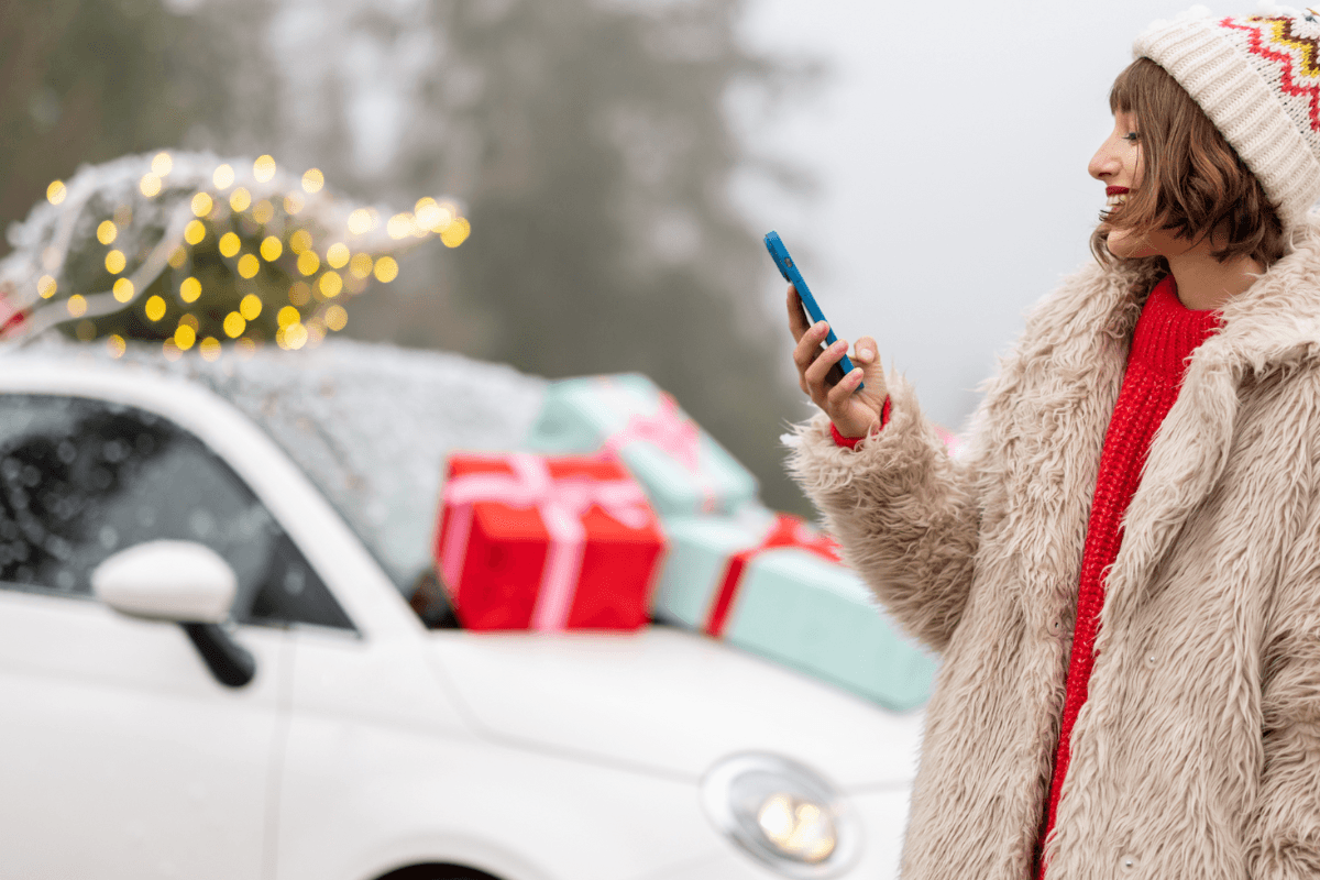 Women reading over cold weather safe driving tips before setting off on a Christmas Journey