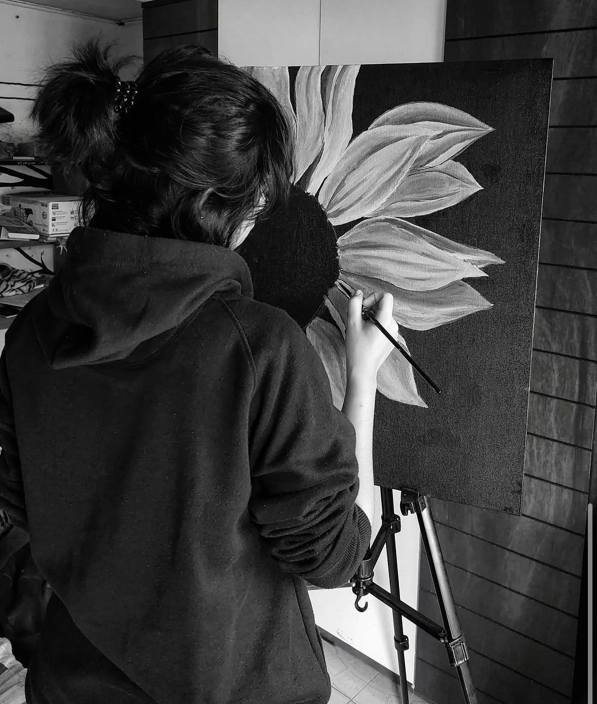 Shreya painting on a large canvas