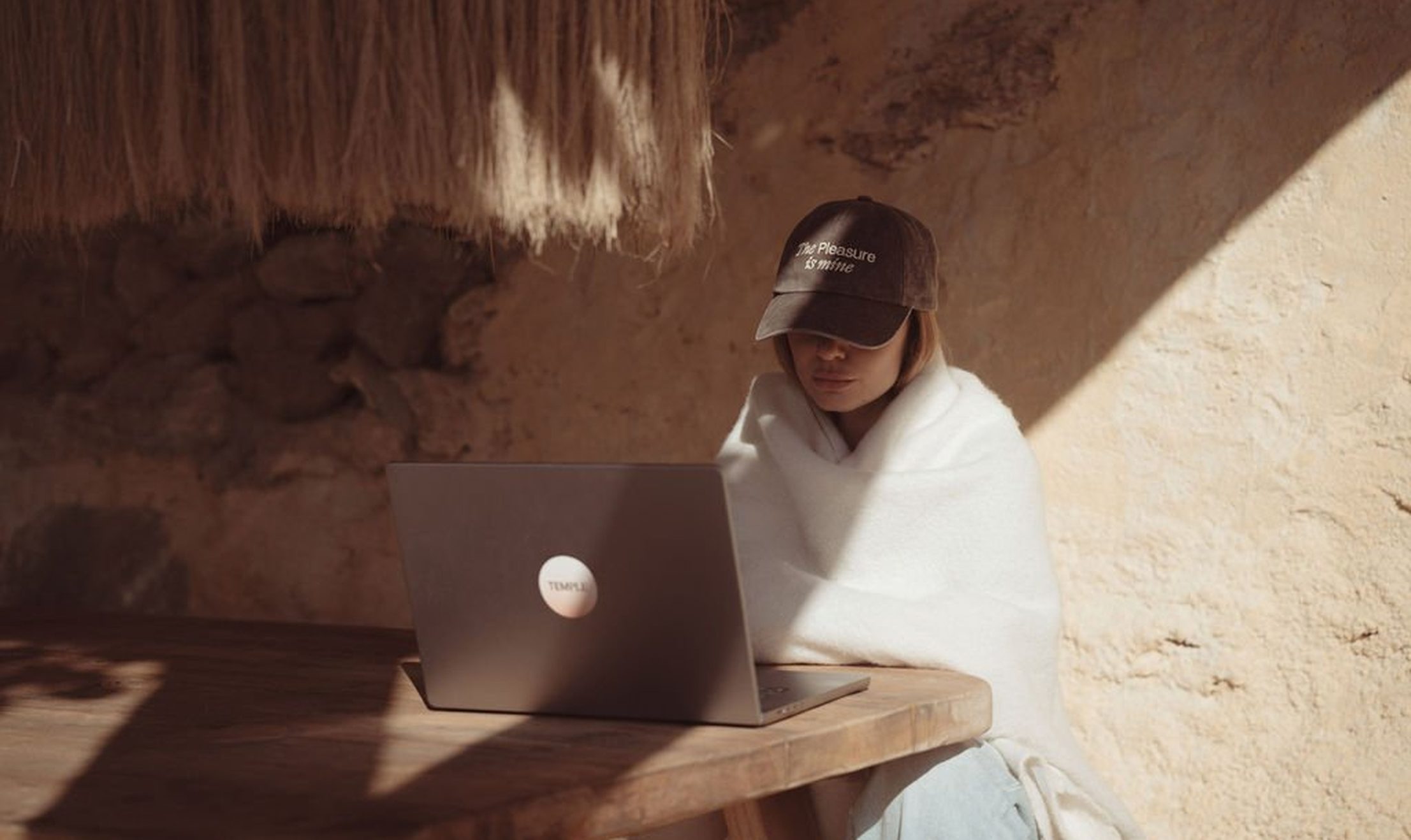 Woman on laptop exploring online course for healing intimacy issues in relationship