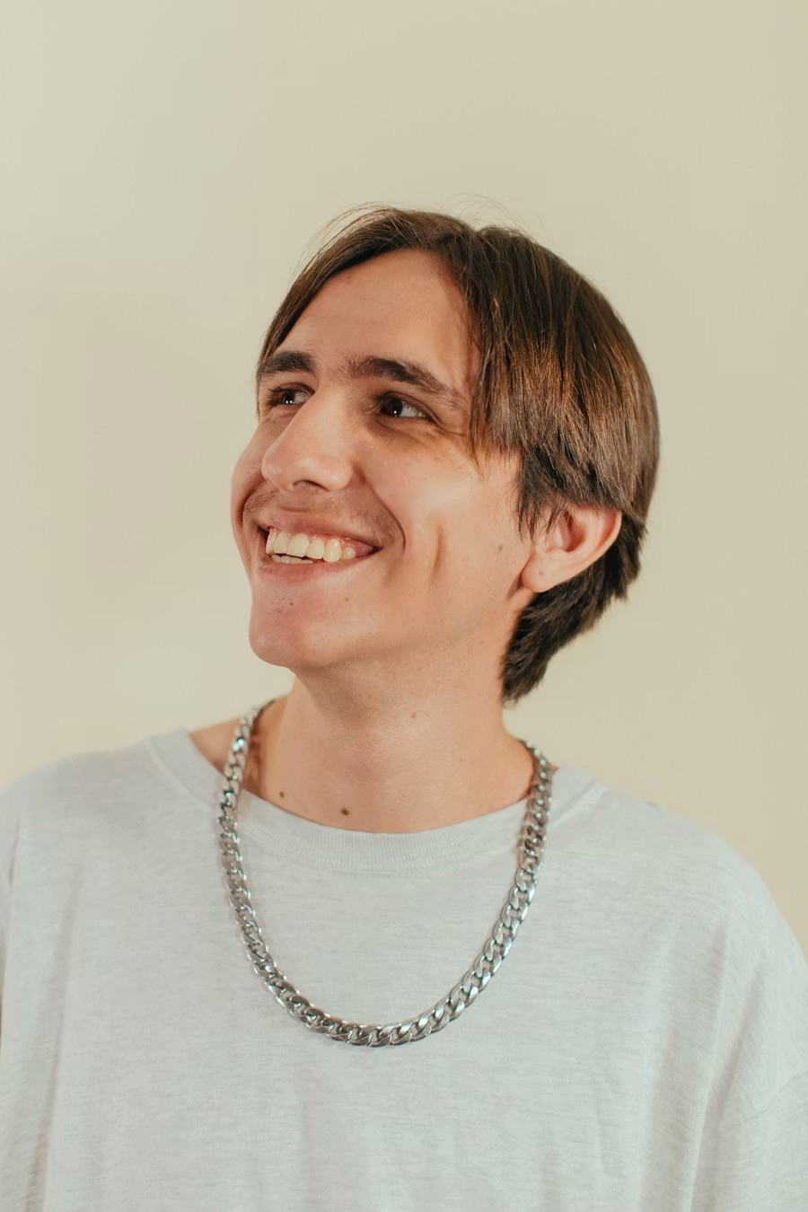 man standing near white wall